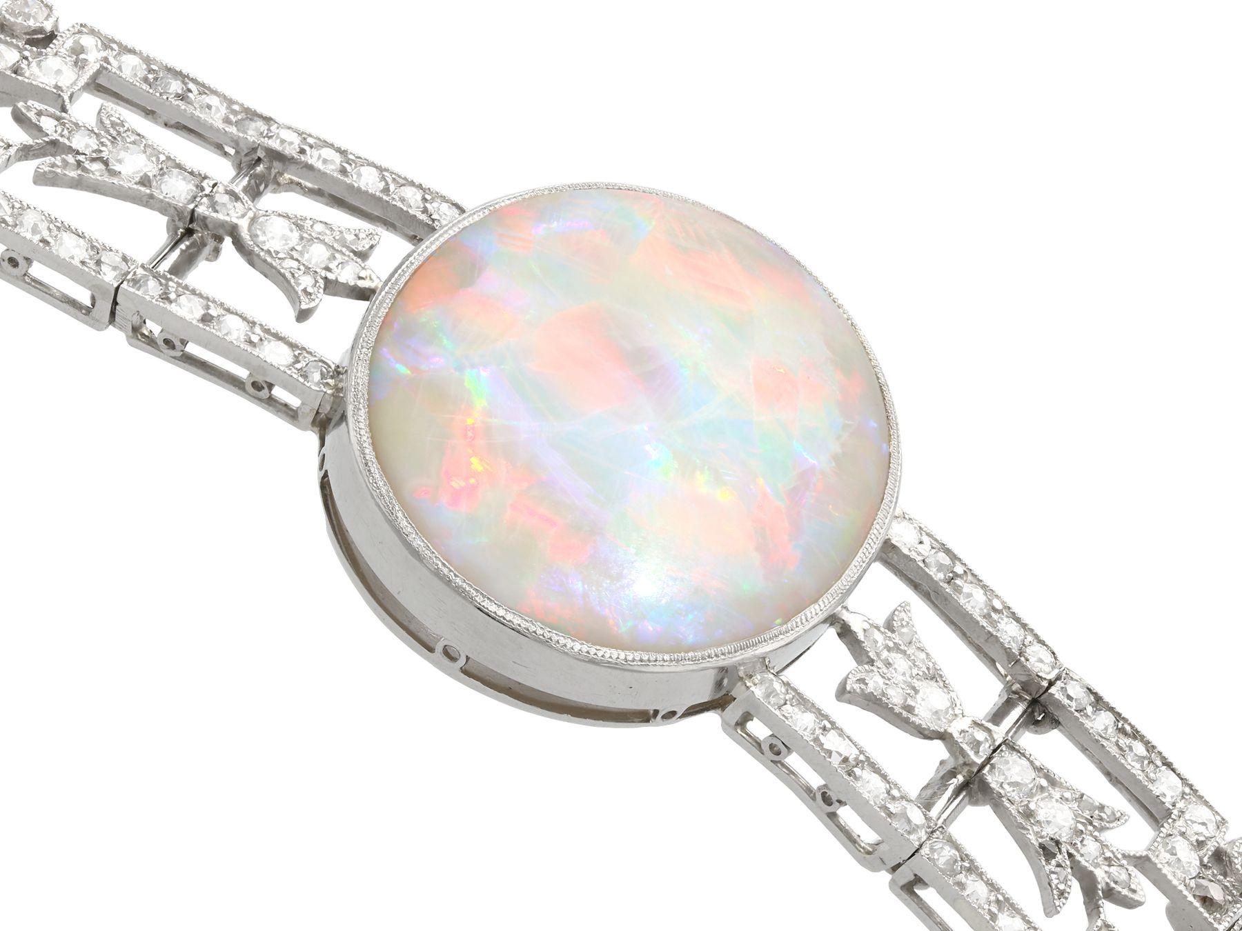 A stunning, fine and impressive antique 24.66 carat opal and 9.81 carat diamond, platinum bracelet; part of our diverse antique jewelry and estate jewelry collections.

This stunning, fine and impressive antique bracelet has been crafted in