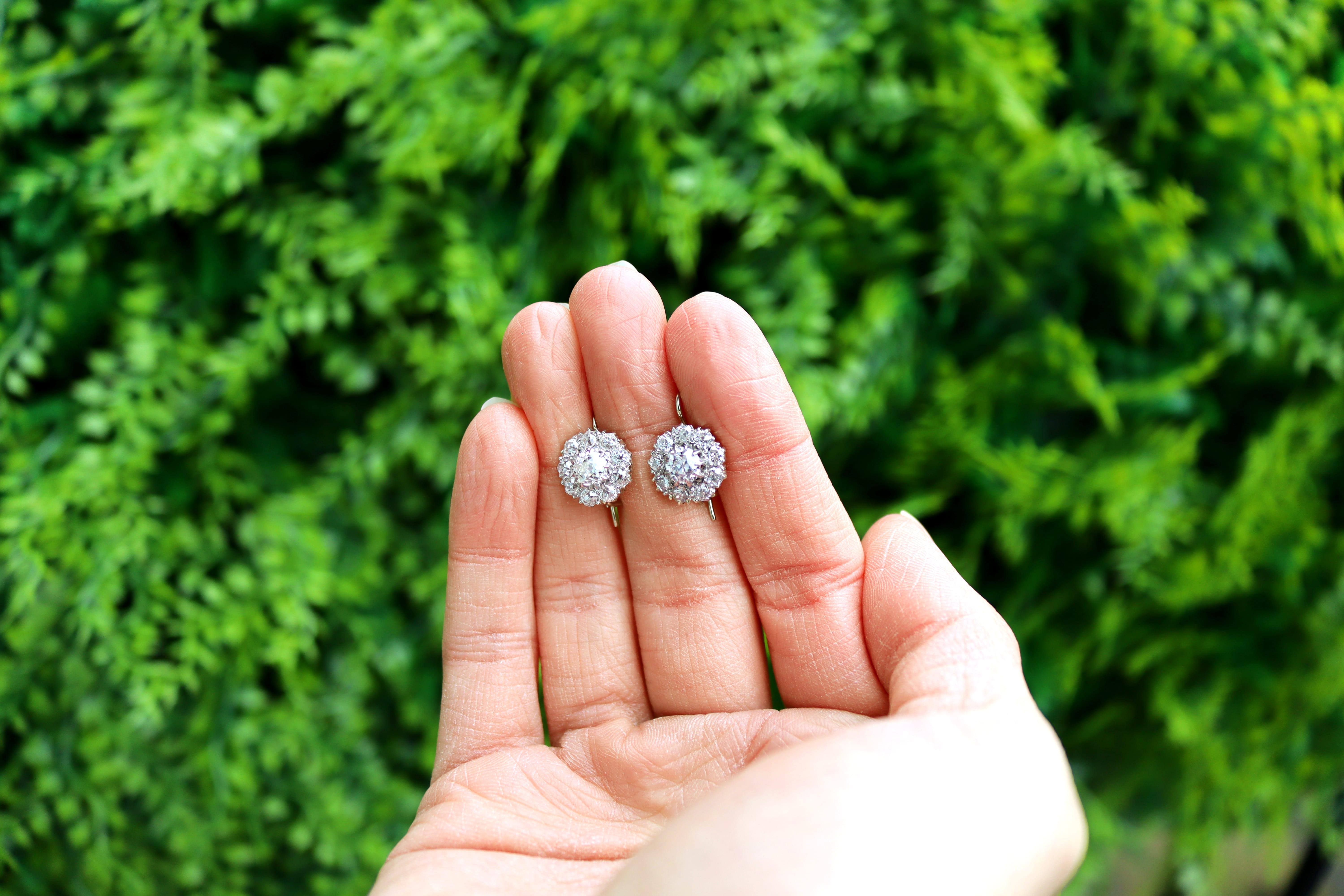A stunning, fine and impressive pair of antique 2.50 carat diamond, platinum and 9 karat white gold set earrings; part of our diverse diamond jewelry and estate jewelry collections.

These stunning antique diamond earrings have been crafted in
