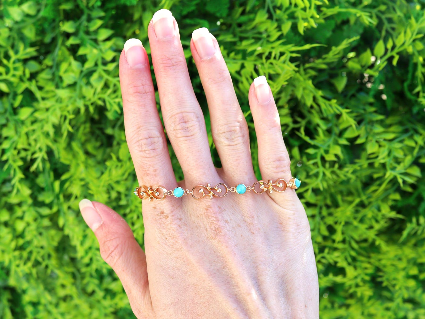 A fine and impressive antique 2.50 carat turquoise and 14 karat yellow gold bracelet; part of our diverse collection of antique turquoise jewelry and estate jewelry.

This stunning, fine and impressive antique bracelet has been crafted in 14k yellow