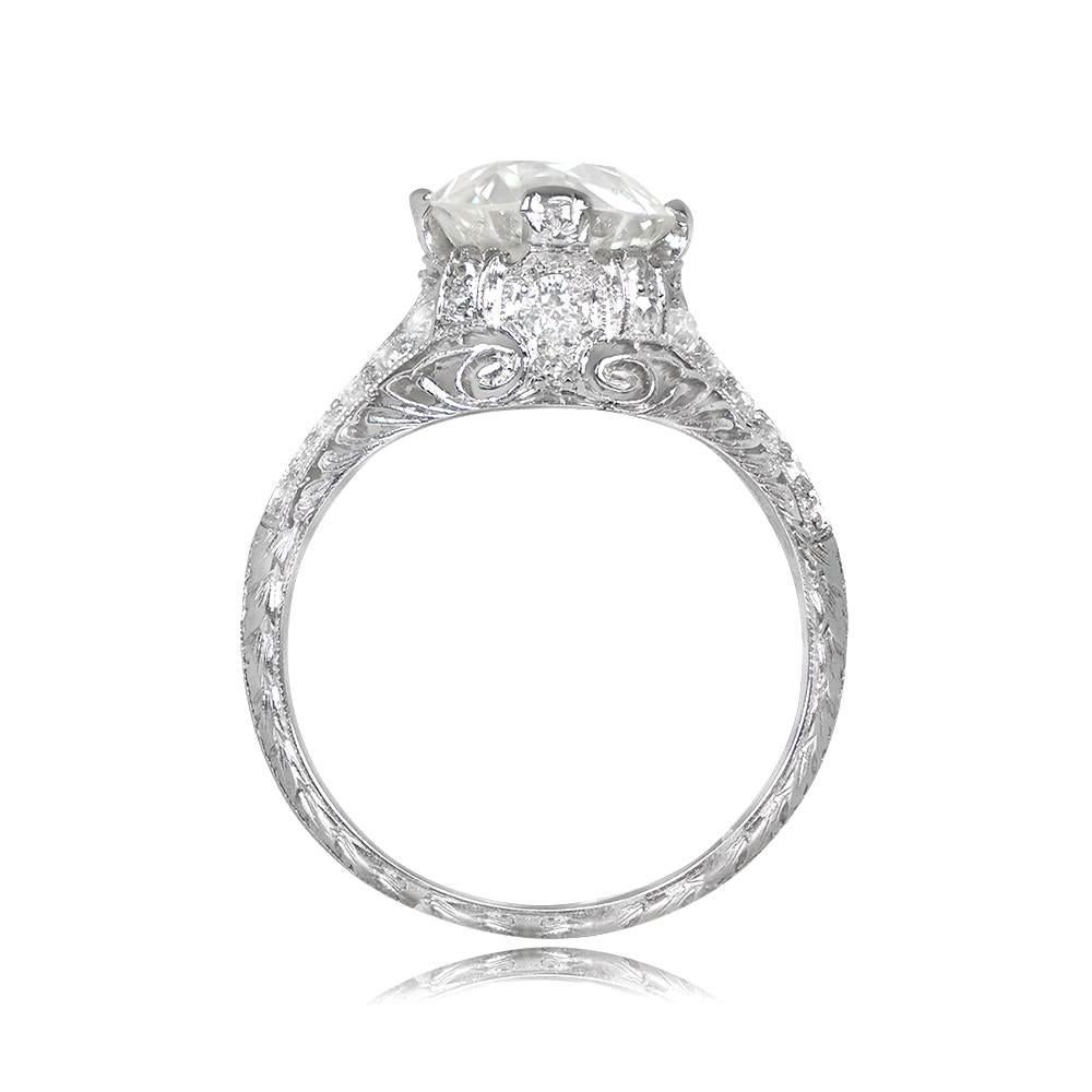Behold the exquisite allure of this antique engagement ring, a true marvel of craftsmanship and timeless elegance. At its center gleams a captivating old European cut diamond, securely nestled in delicate prongs, boasting a remarkable weight of 2.50