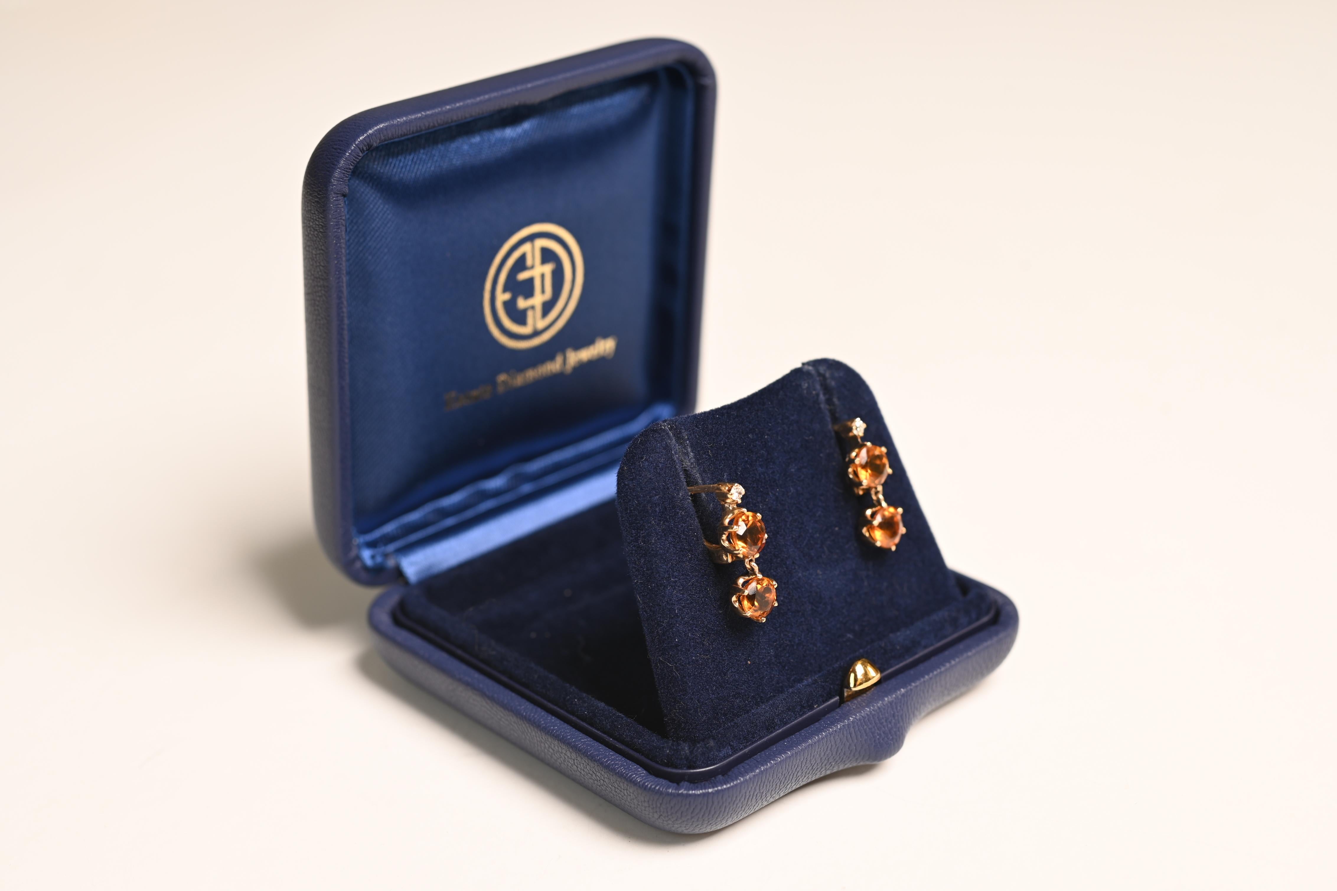 This exquisite pair of Victorian earrings is a timeless example of 19th-century craftsmanship and understated elegance. Each earring showcases two luminous round citrine gemstones, beautifully set in classic six-prong mountings that highlight their