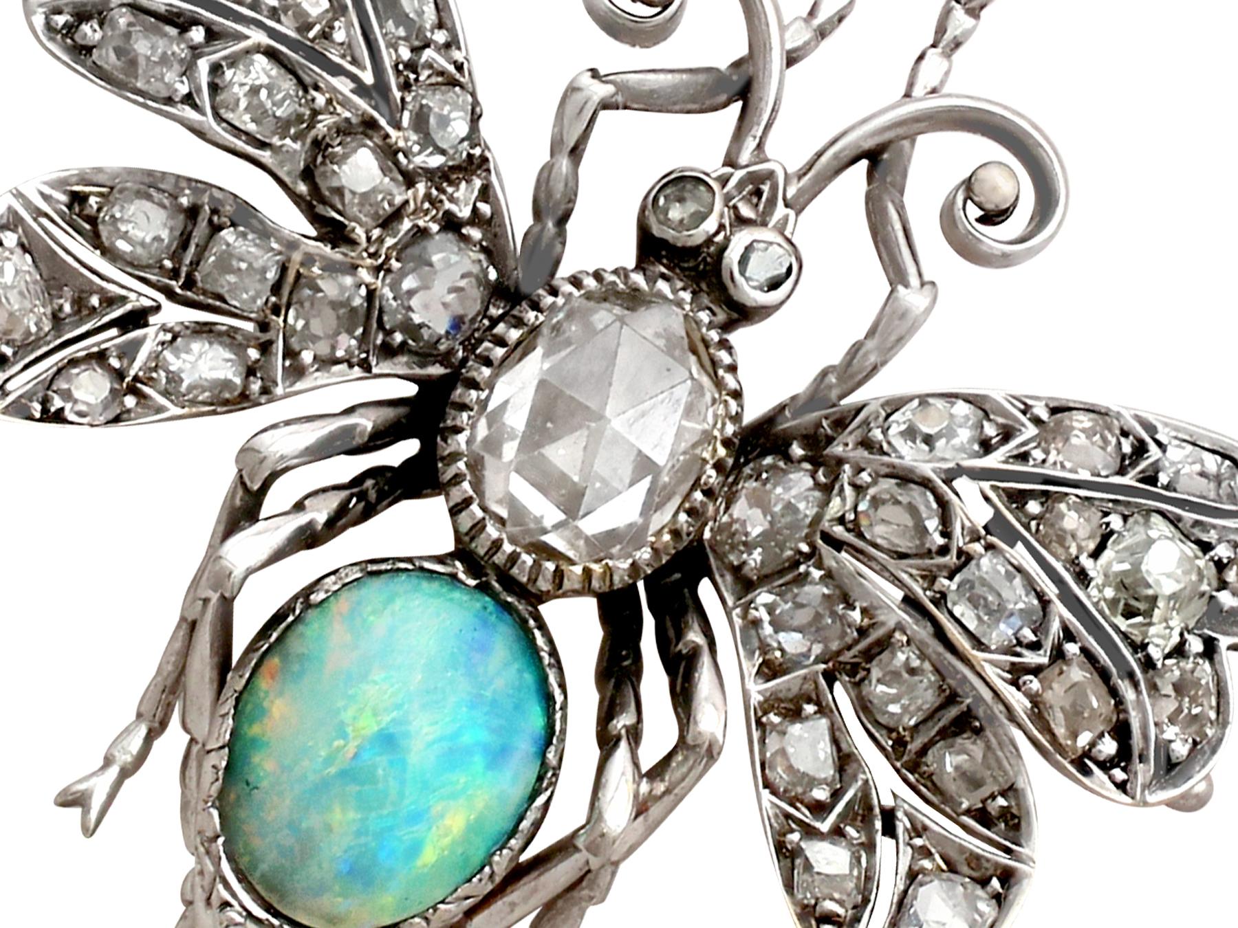 A stunning, fine and impressive antique 2.53 carat diamond and 0.84 carat opal, 18 karat white gold brooch in the form of a winged insect; part of our antique jewellery / estate jewelry collections.

This stunning, fine antique insect brooch has