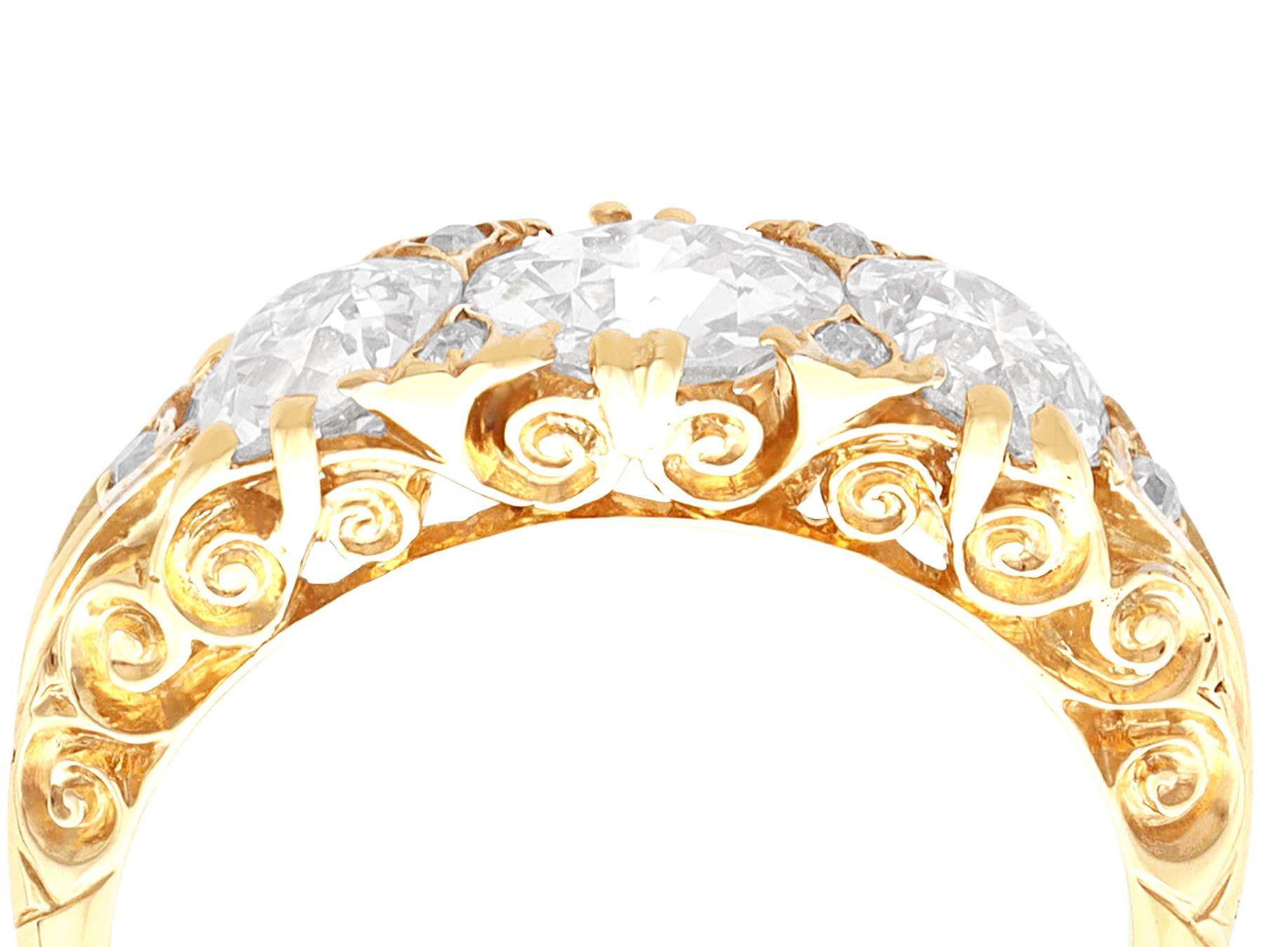 A stunning, fine and impressive antique Victorian 2.56 carat diamond and 18 karat yellow gold three stone ring; part of our antique jewelry/estate jewelry collections.

This stunning antique trilogy ring has been crafted in 18k yellow gold.

The