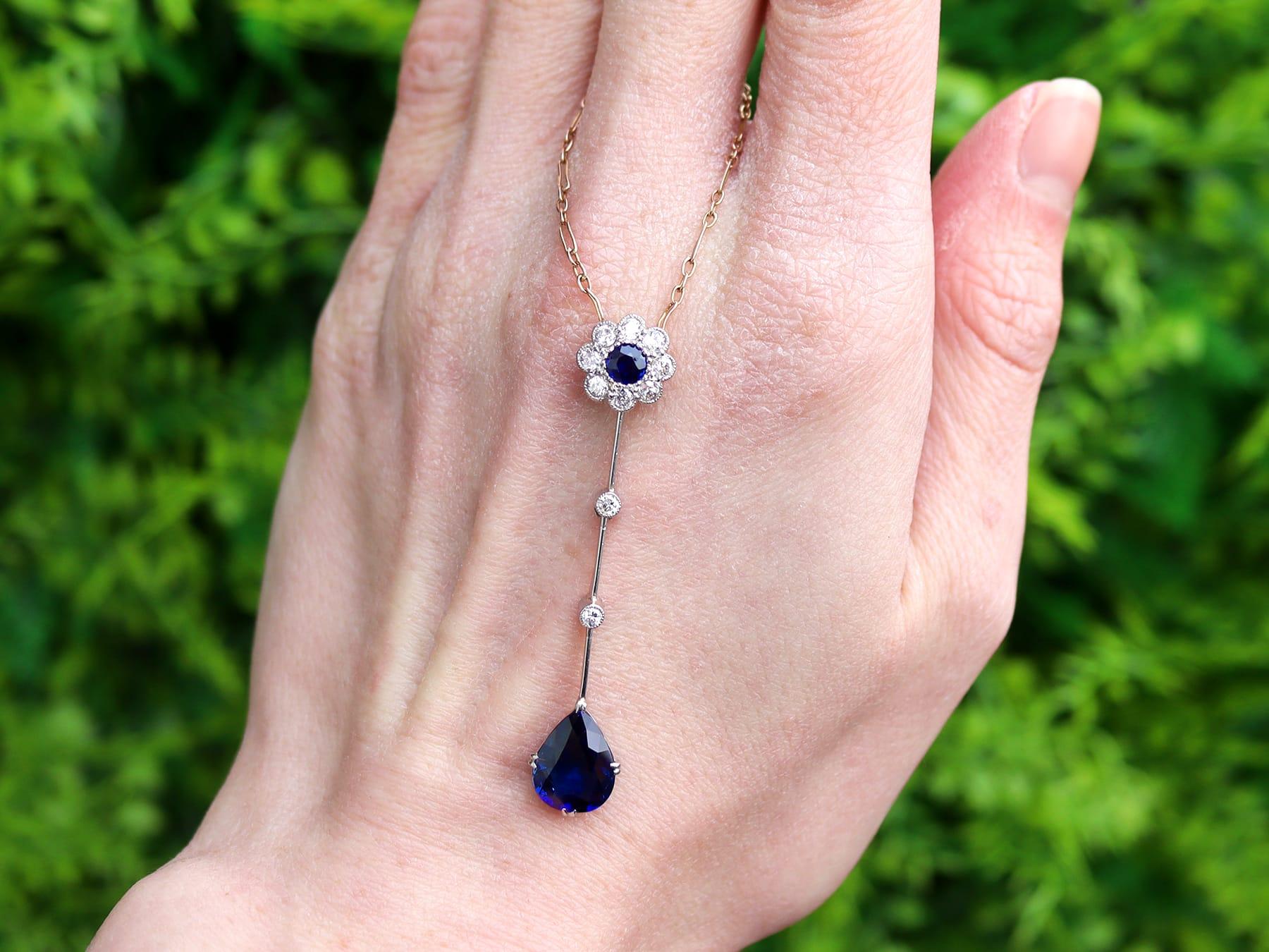 A stunning, fine and impressive antique Edwardian 2.59 carat sapphire and 0.32 carat diamond, 18 karat yellow gold and platinum pendant with a 15k yellow gold chain; part of our diverse antique jewellery and estate jewelry collections.

This
