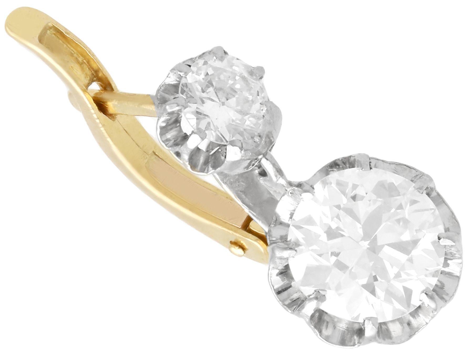 A stunning, fine and impressive pair of antique 2.64 carat diamond and 18 karat yellow gold, platinum set drop earrings; part of our diverse antique estate jewelry collections.

These stunning antique drop earrings have been crafted in 18k yellow