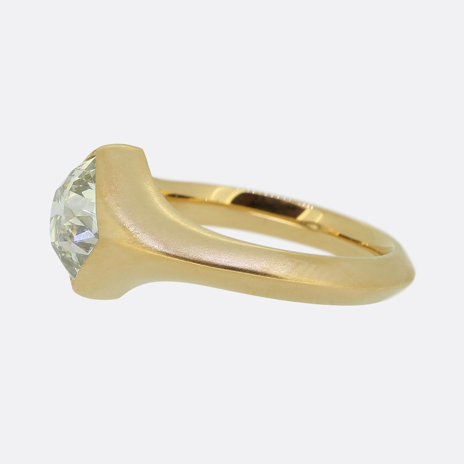 Here we have an exceptional single stone ring. This piece features a prominent antique square cushion-cut diamond which sits alone and proud at the centre of the face whilst showcasing a bright white colour tone. This impressive diamond is set in a