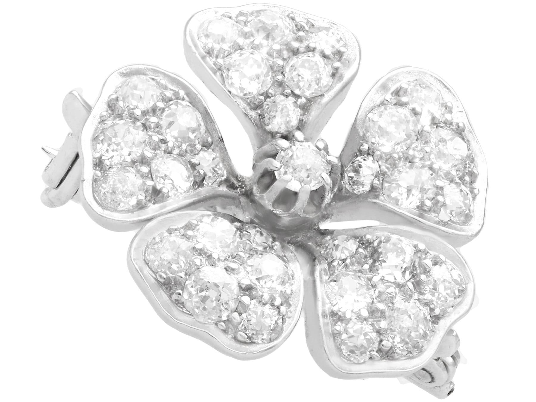 Round Cut Antique 2.75 Carat Diamond and White Gold Floral Brooch For Sale