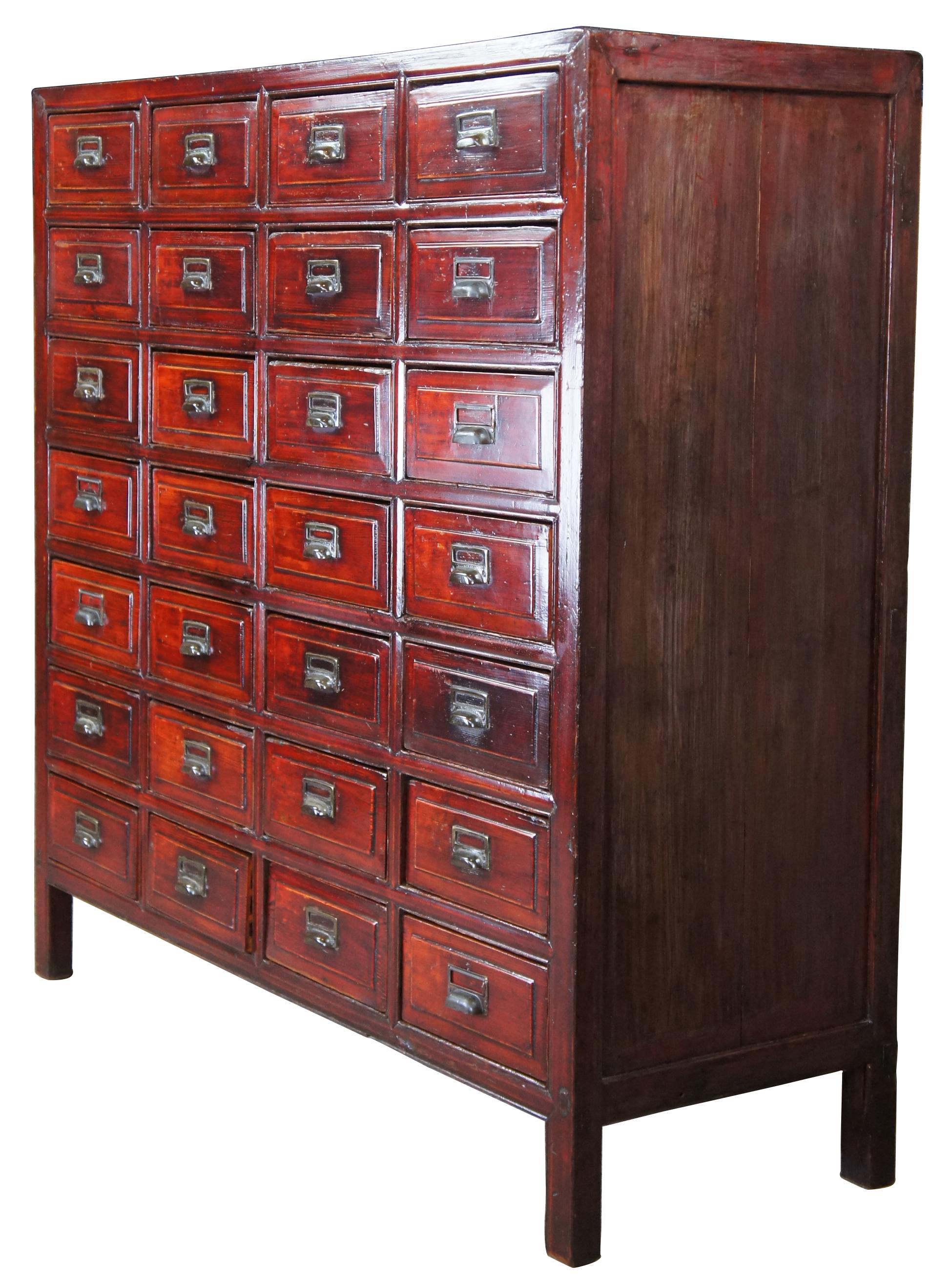 Chinese apothecary, pharmacy or medicine chest, circa 19th century. Made from lacquered elm with mortise and tenon construction. Features 28 partitioned drawers with metal hardware.
  