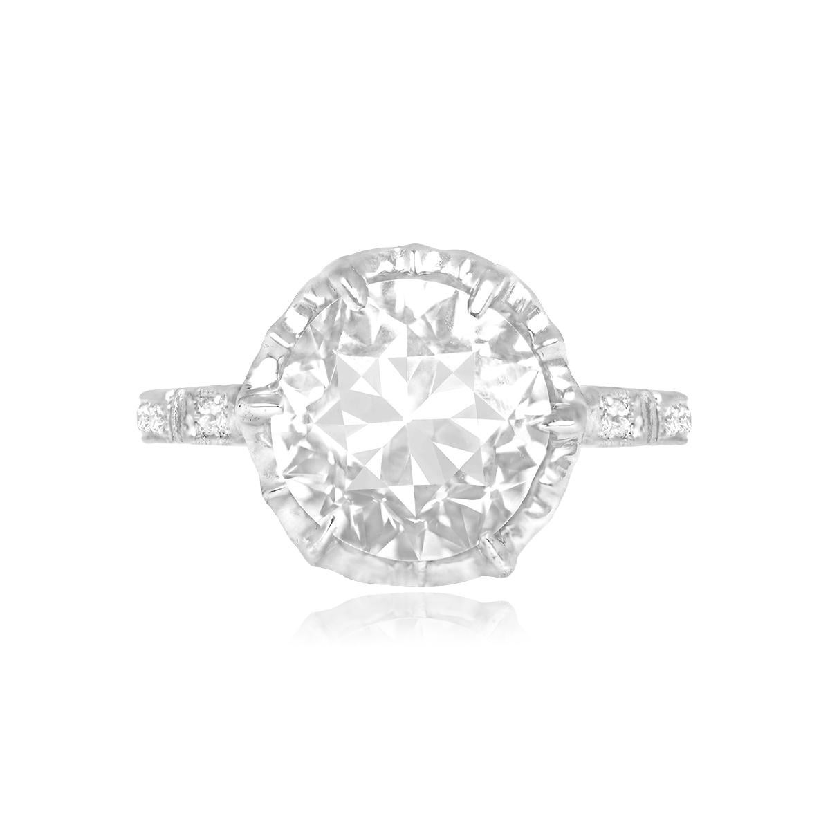 Sophisticated Art Deco engagement ring showcases a prong-set, 2.88-carat old European cut diamond (L color, VS1 clarity). Three additional old European cut diamonds grace each shoulder. The ring boasts an openwork under gallery design and delicate