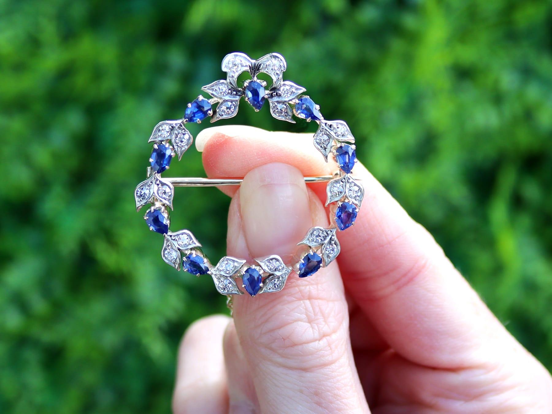 A fine and impressive antique Victorian 2.90 carat sapphire and 0.92 carat diamond, 9 karat yellow gold and silver set wreath brooch; part of our diverse collection of sapphire brooches.

This stunning, fine and impressive antique brooch has been