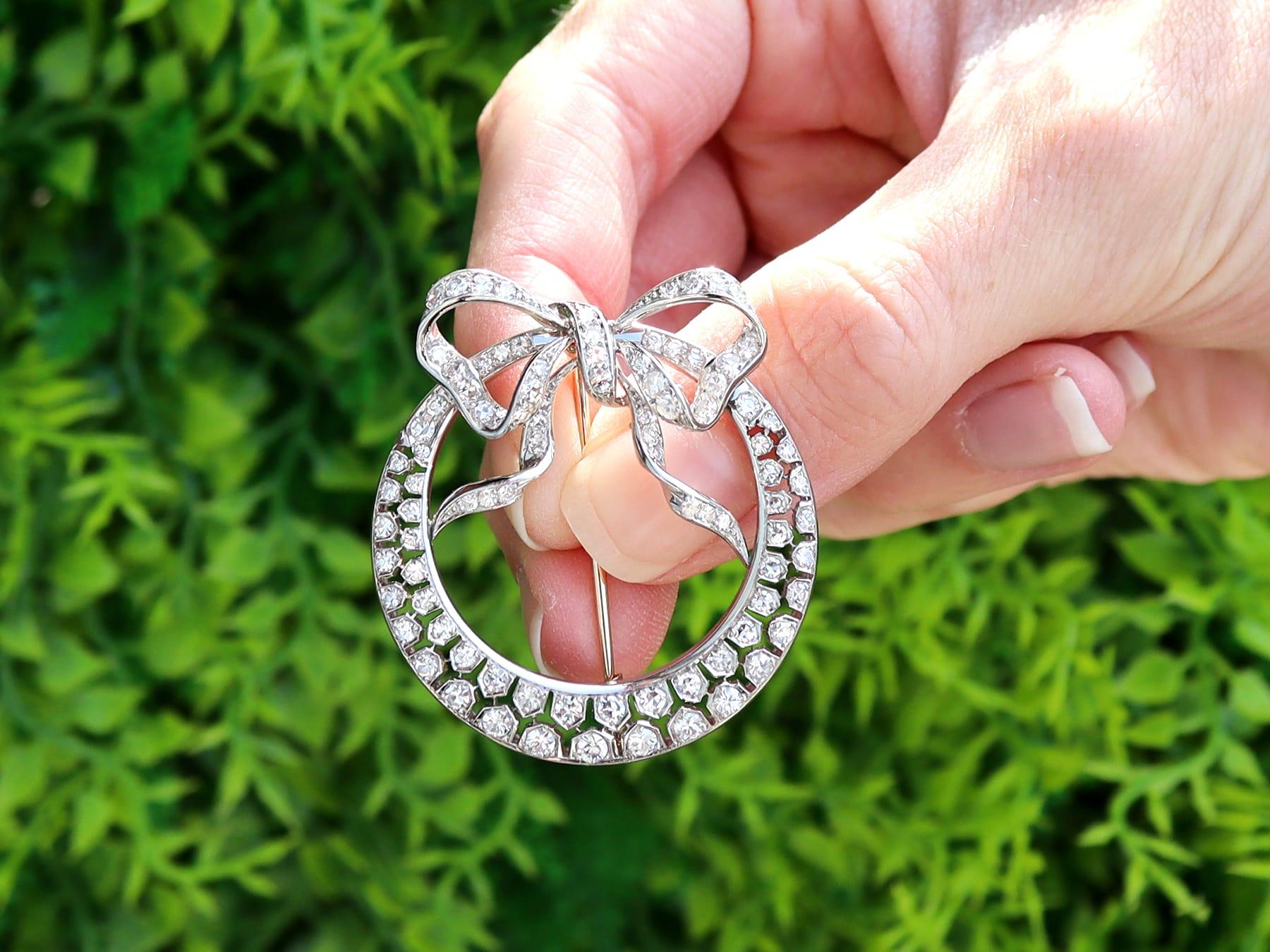 A stunning, fine and impressive antique 2.95 carat diamond and platinum, 15 karat yellow gold set crescent brooch; part of our diverse collection of diamond brooches.

This fine and impressive 1930's diamond brooch has been crafted in platinum.

The