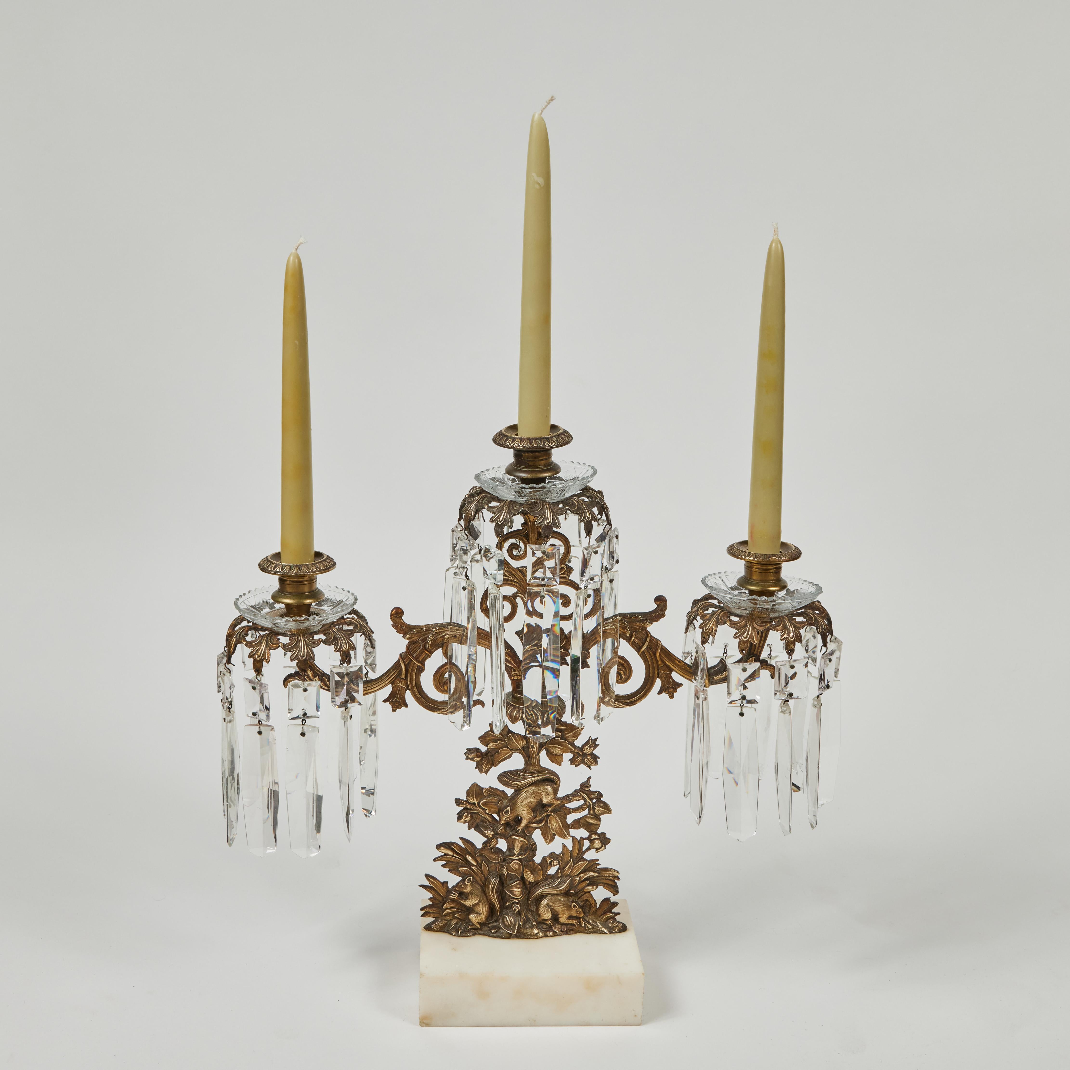 Antique 3-arm candelabra w/ marble base + Crystal Prisms, brass body depicts playful squirrels.