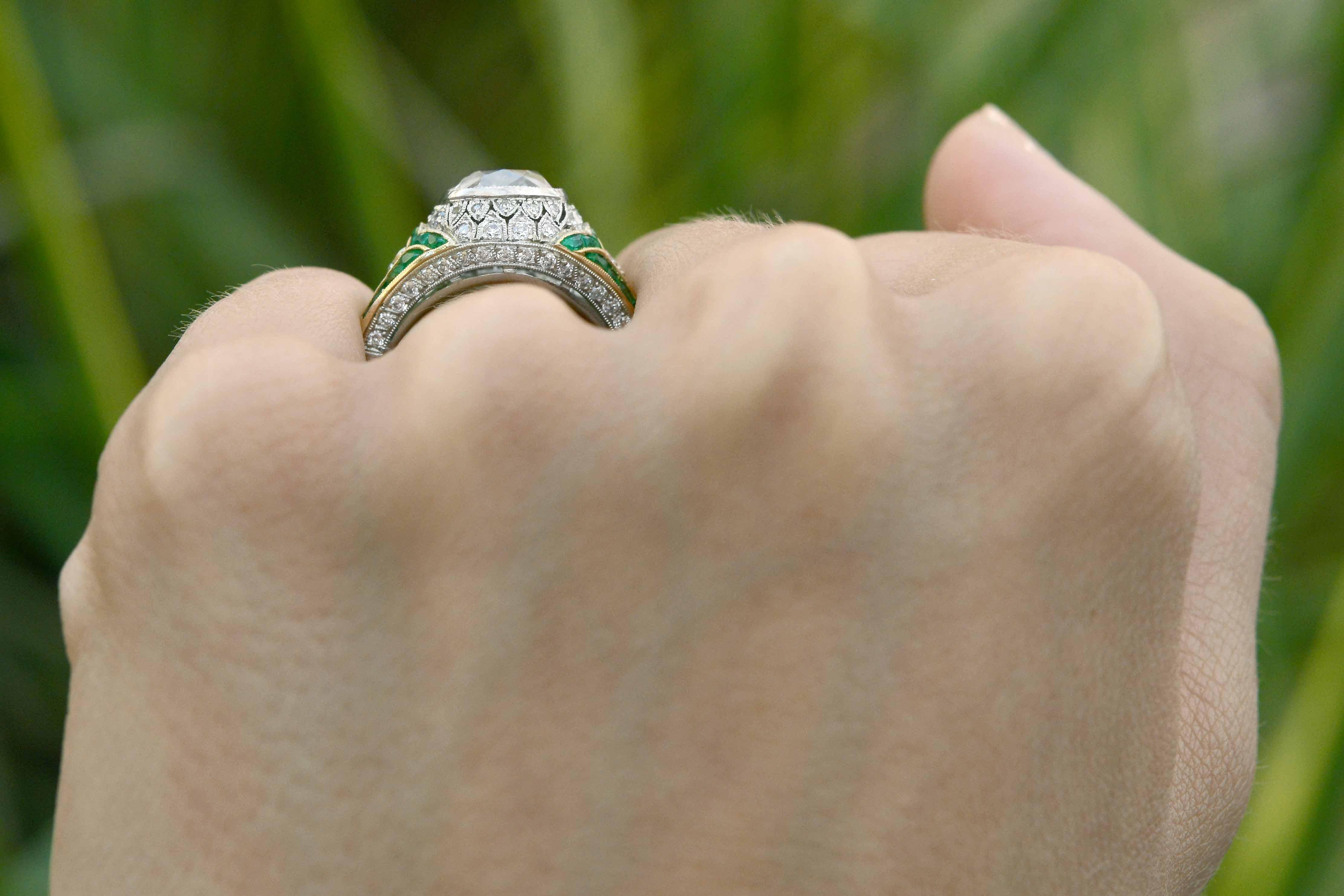 diamond ring with emerald accents
