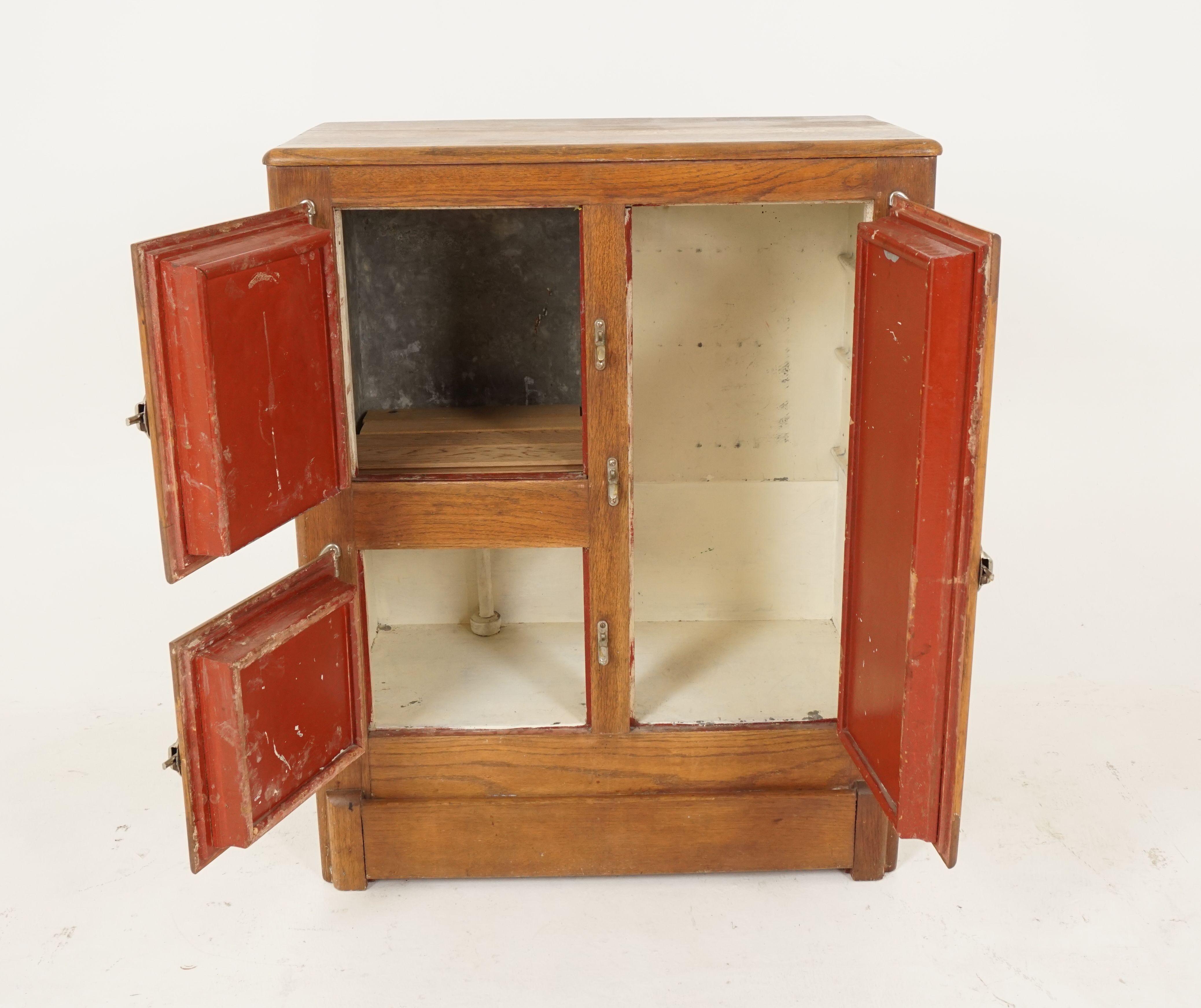Antique 3 door oak ice box front loader, America 1910, B2557 

America 1910
Solid oak
Moulded top with beveled edge
Tall paneled door on the right opens to reveal tin lined compartment
On the left you have two paneled doors which open to