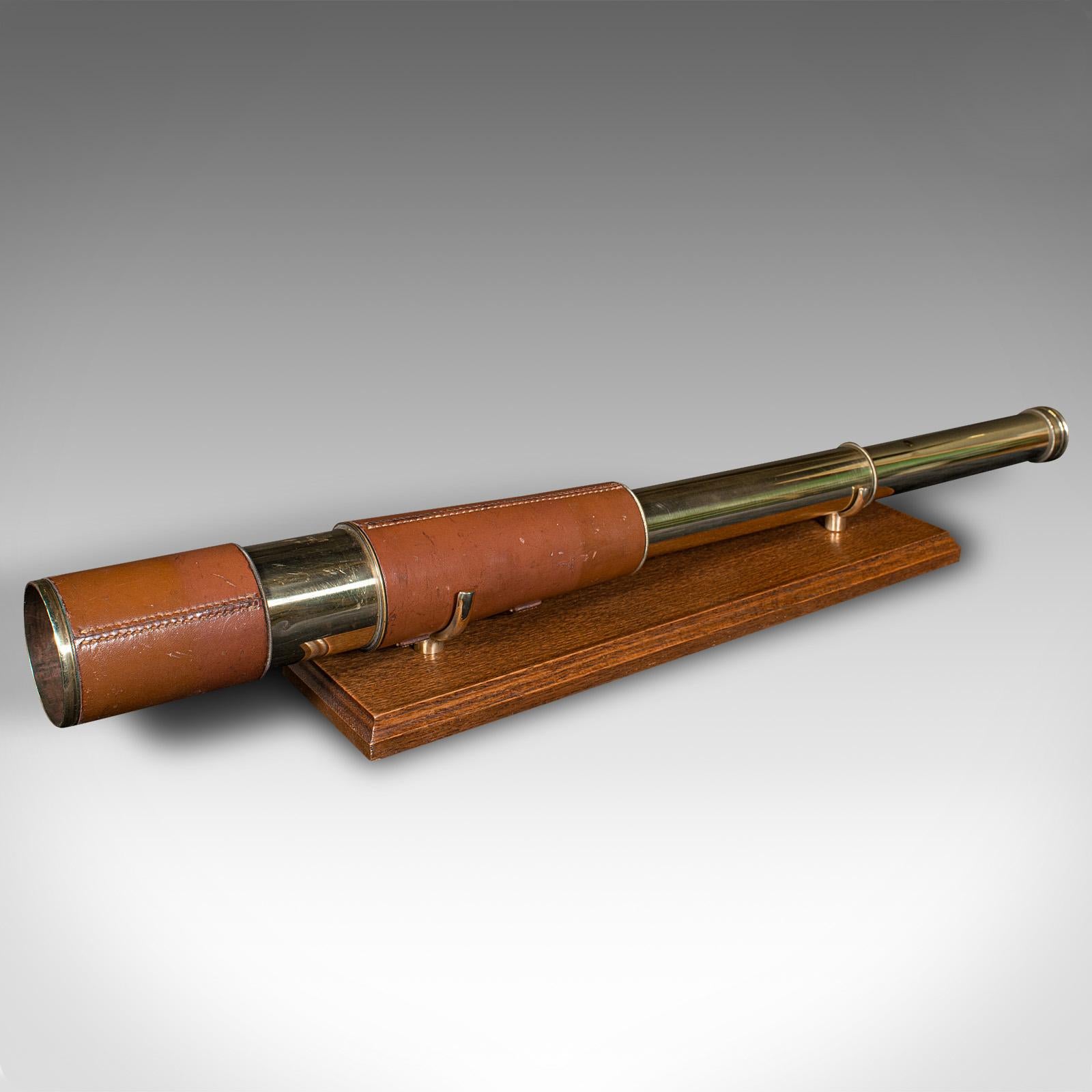 This is an antique 3-draw telescope. An English, brass terrestrial spotter's refractor in leather case, dating to the Great War period, circa 1915.

Perfect for bird watching, landscape appreciation, wildlife, or maritime observation. Equally