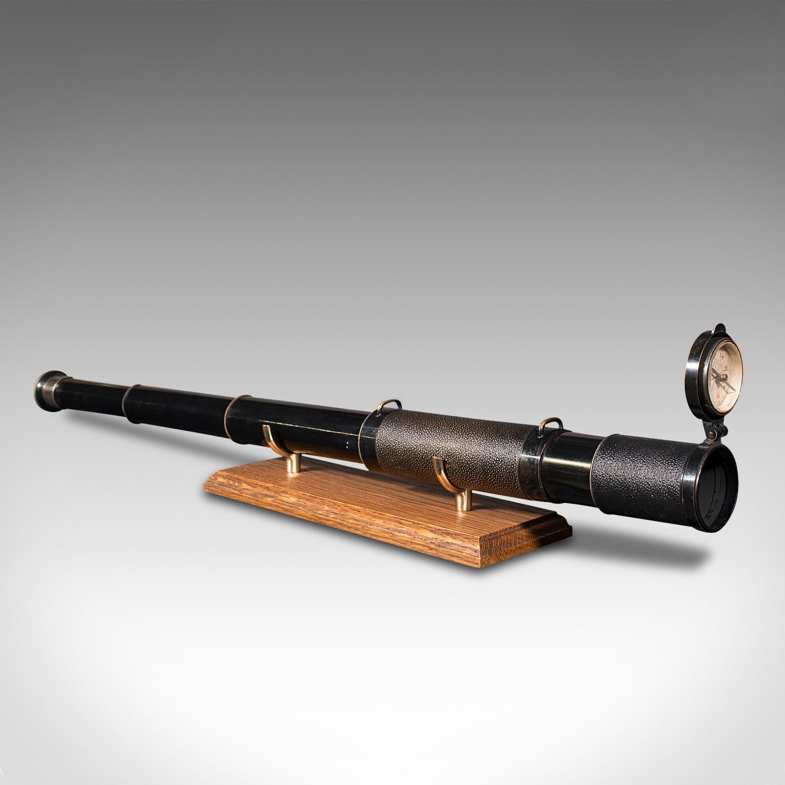This is an antique 3 draw telescope. An English, enamelled brass 'The Sign Post' terrestrial refractor with compass by Lawrence & Mayo of London, dating to the late Victorian period, circa 1900.

Perfect for bird watching, landscape appreciation,