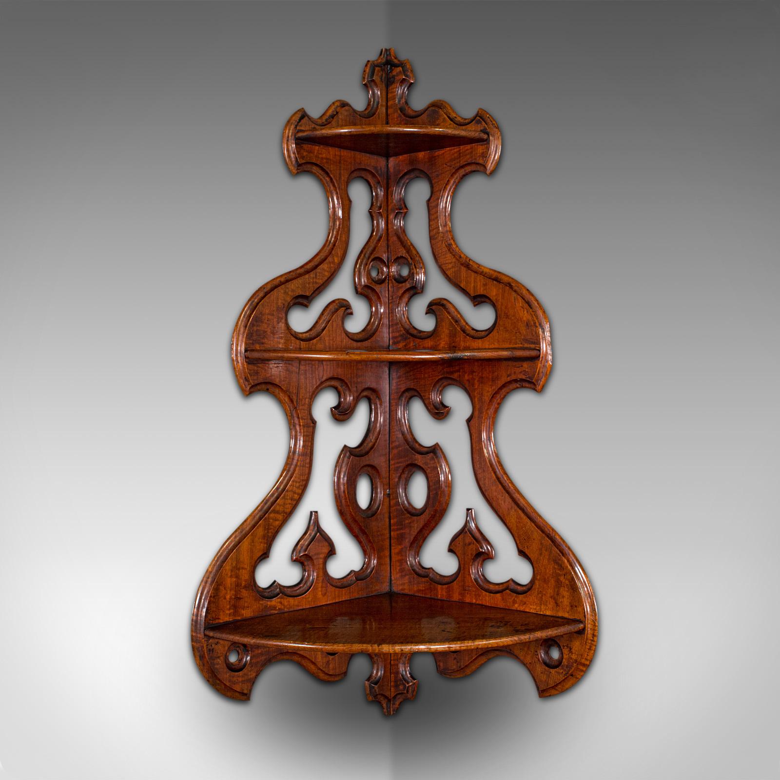 This is an antique three-tier hanging whatnot. An English, walnut corner wall shelf or candle bracket, dating to the early Victorian period, circa 1850.

Distinctive wall mounted corner whatnot with striking form
Displays a desirable aged patina