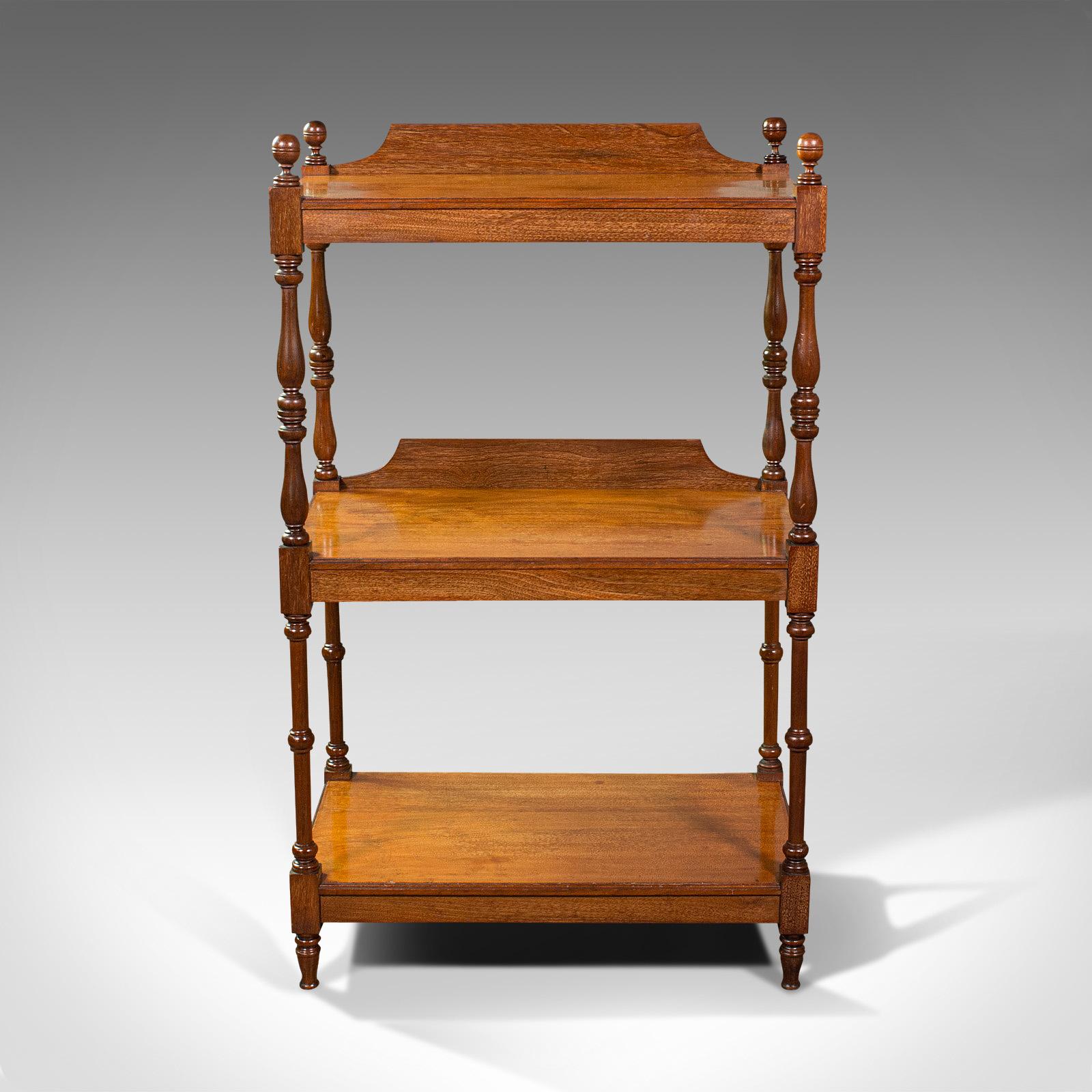 This is an antique 3-tier whatnot. An English, mahogany buffet or display stand, dating to the early Victorian period, circa 1850.

Attractive example of Victorian display furniture
Displays a desirable aged patina throughout
Select mahogany