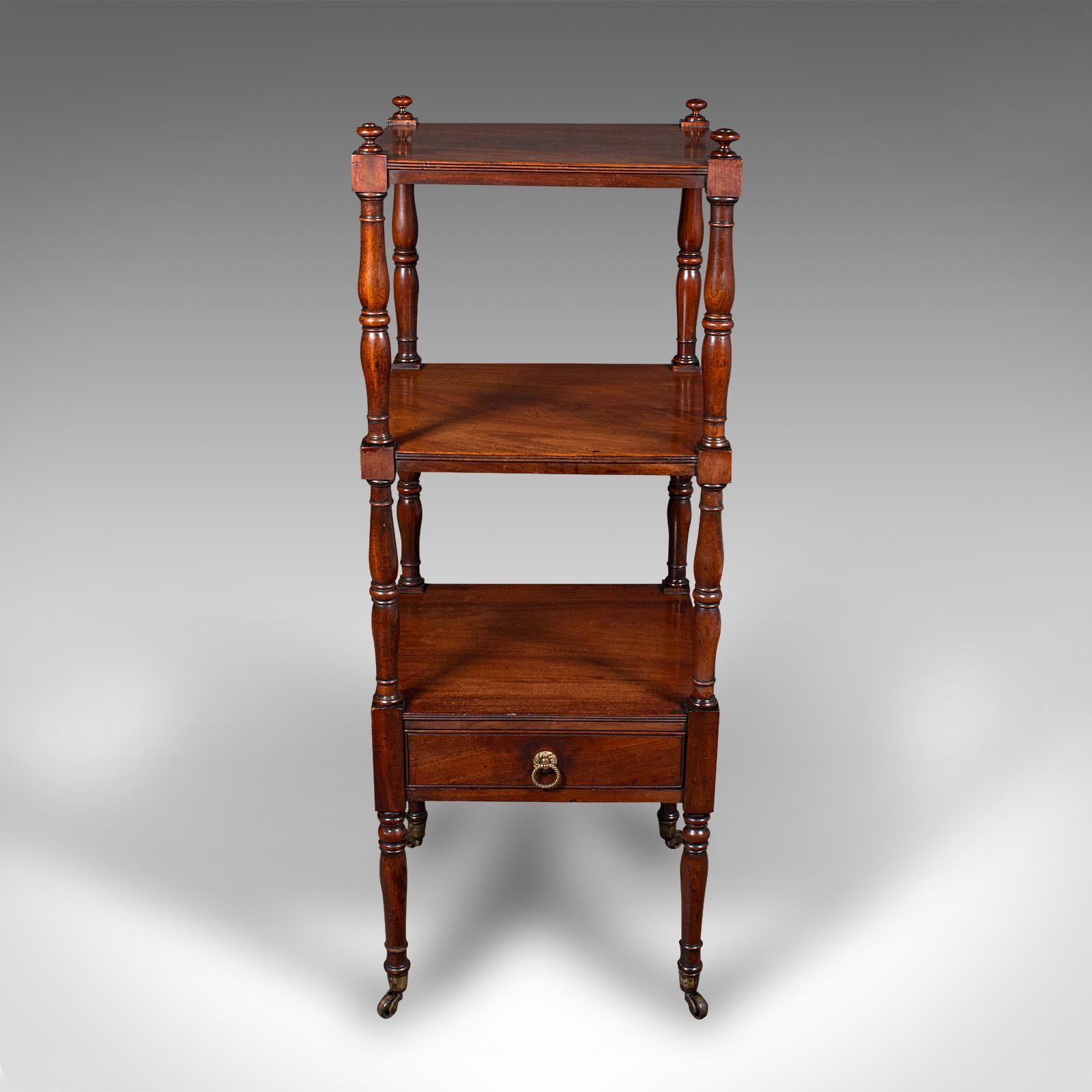 This is an antique 3 tier whatnot. An English, mahogany open display stand, dating to the Georgian period, circa 1800.

Attractive example of Georgian display furniture
Displays a desirable aged patina and in good order
Select stocks show rich