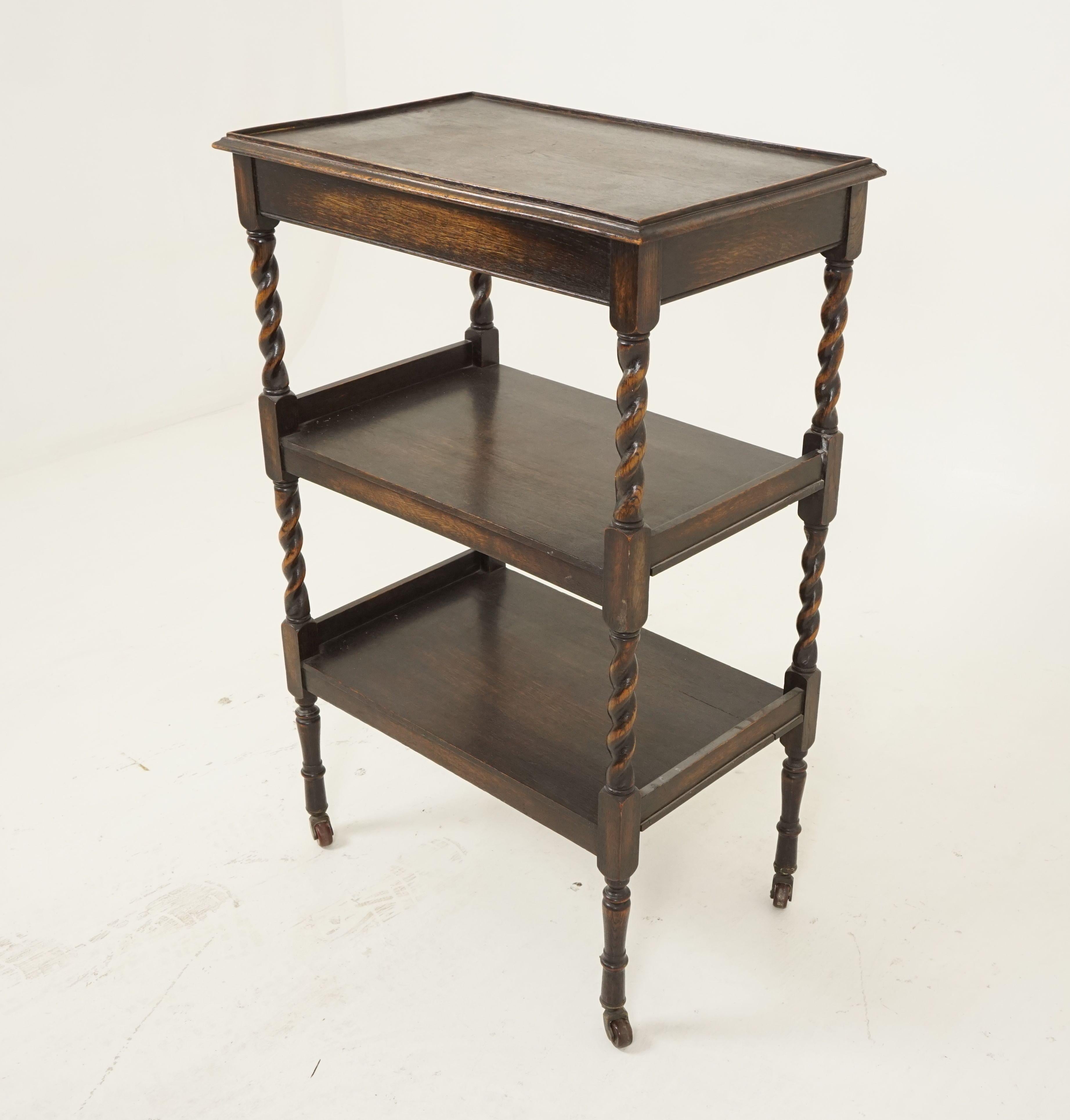 Antique 3 tiered oak barley twist stand, trolley, serving table, Scotland 1910, B2716

Scotland 1910
Solid oak
Original finish
Rectangular moulded top
Small gallery on all sides
Two undershelves below
All standing on tall barley twist