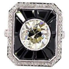 Anillo antiguo de oro con ónix y un diamante de 3,01 quilates de talla europea antigua