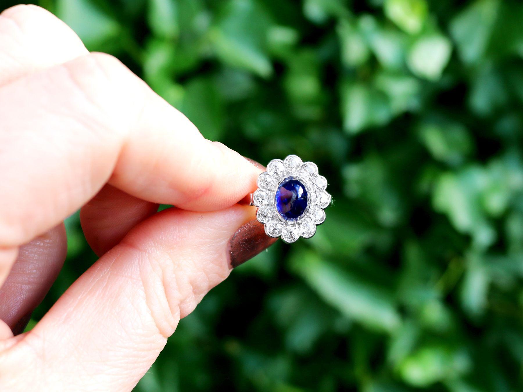 A stunning, fine and impressive 3.03 carat sapphire and 1.80 carat diamond, 15 karat white gold dress ring; part of our antique jewelry and estate jewelry collections.

This stunning, fine and impressive antique cabochon cut sapphire ring has been