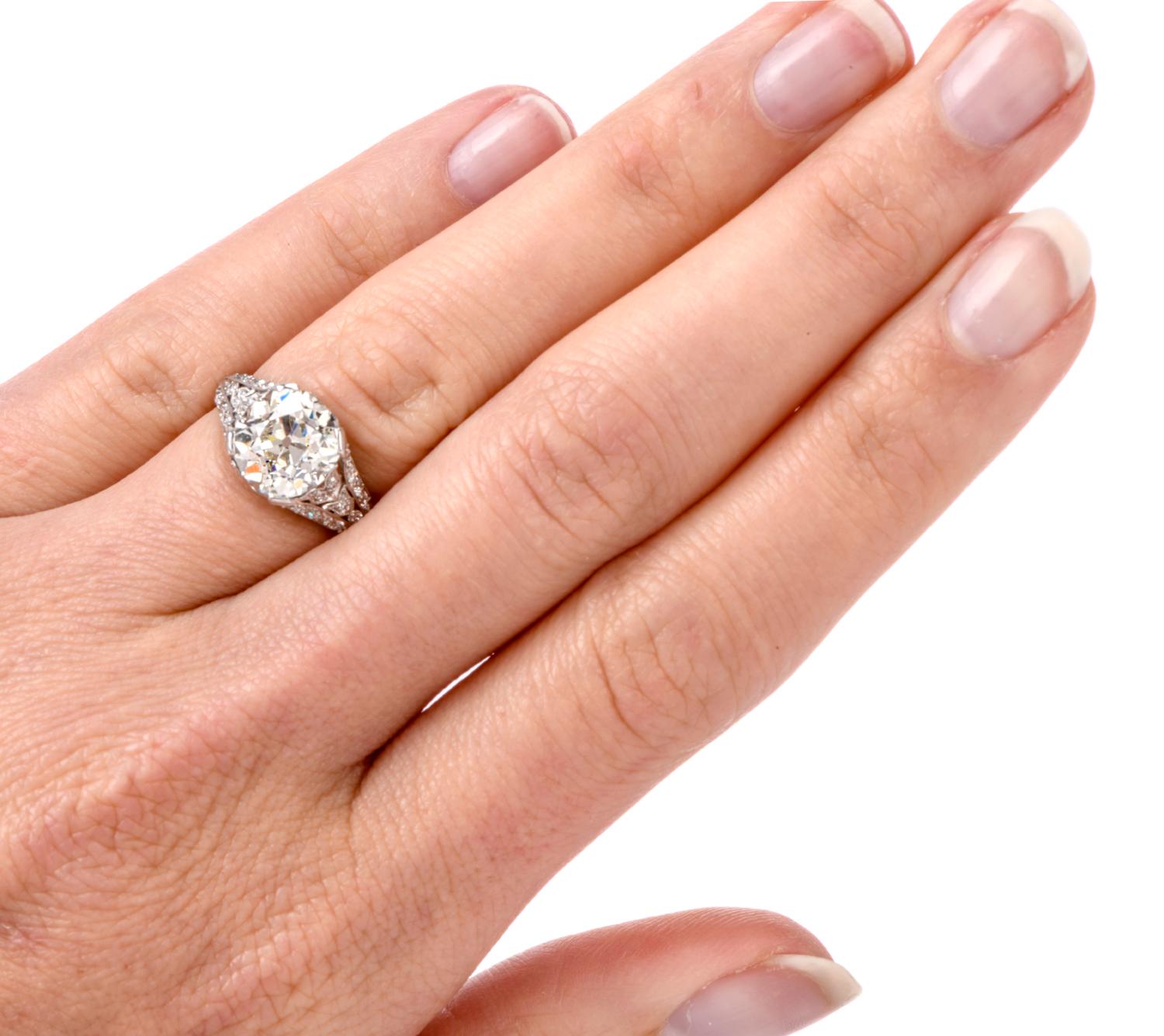 This exquisite 1920s Diamond Engagement Ring was inspired with a floral motif and crafted in Platinum. Adorning the center is a bright and bold Old European Cut Diamond weighing approx. 3.07 carat and is of I color and VS2-SI1 clarity.

Approx. 40