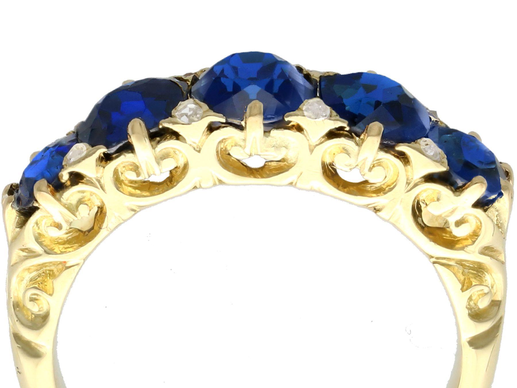 Oval Cut Antique 3.15 Carat Basaltic Sapphire and Diamond Five Stone Ring in Yellow Gold For Sale