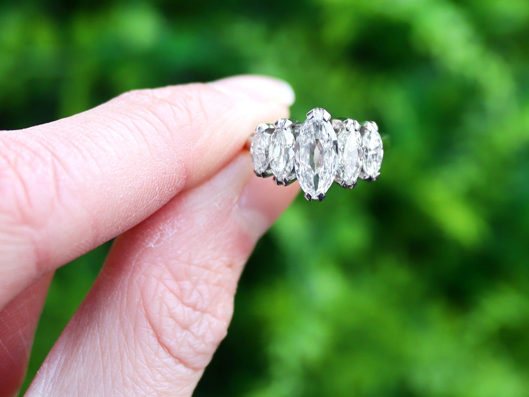A stunning, fine and impressive antique 3.15 carat diamond and 18 karat white gold five stone ring; part of our diverse diamond jewelry and estate jewelry collections.

This stunning, fine and impressive antique engagement ring has been crafted in