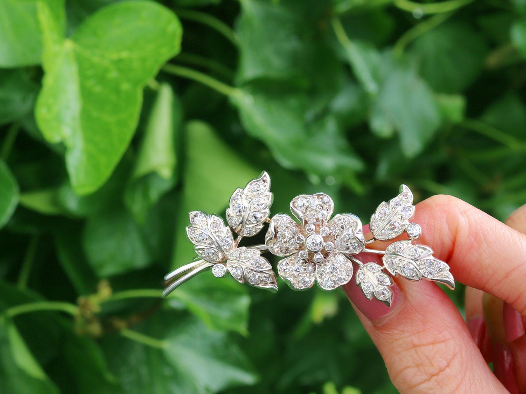 A stunning, fine and impressive antique European 3.25 carat diamond and 9 karat yellow gold, silver set flower brooch; part of our diverse antique jewelry and estate jewelry collections

This stunning, fine and impressive diamond and gold brooch has