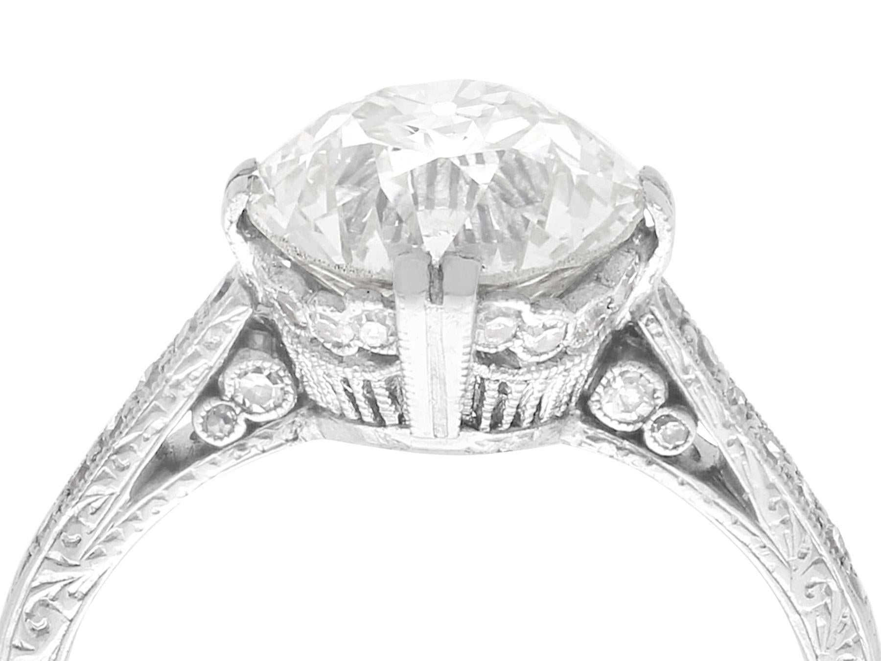 A stunning, fine and impressive antique 3.31 carat diamond (total) and platinum solitaire ring; part of our diamond jewelry/estate jewelry collections.

This stunning, fine and impressive antique solitaire engagement ring has been crafted in