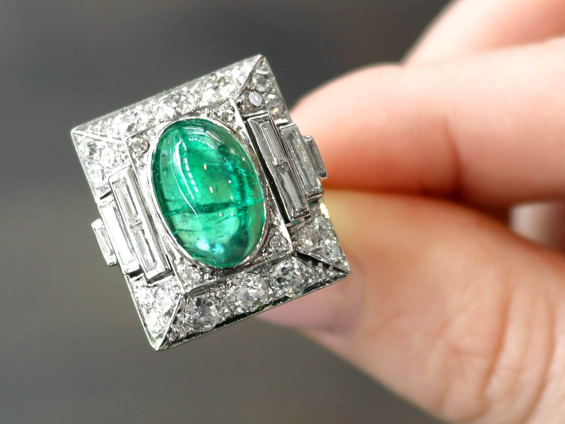 A stunning antique 3.40 carat Colombian emerald and 2.72 carat diamond, platinum cocktail ring; part of our diverse antique jewelry and estate jewelry collections.

This stunning, fine and impressive Colombian cabochon cut emerald cocktail ring has