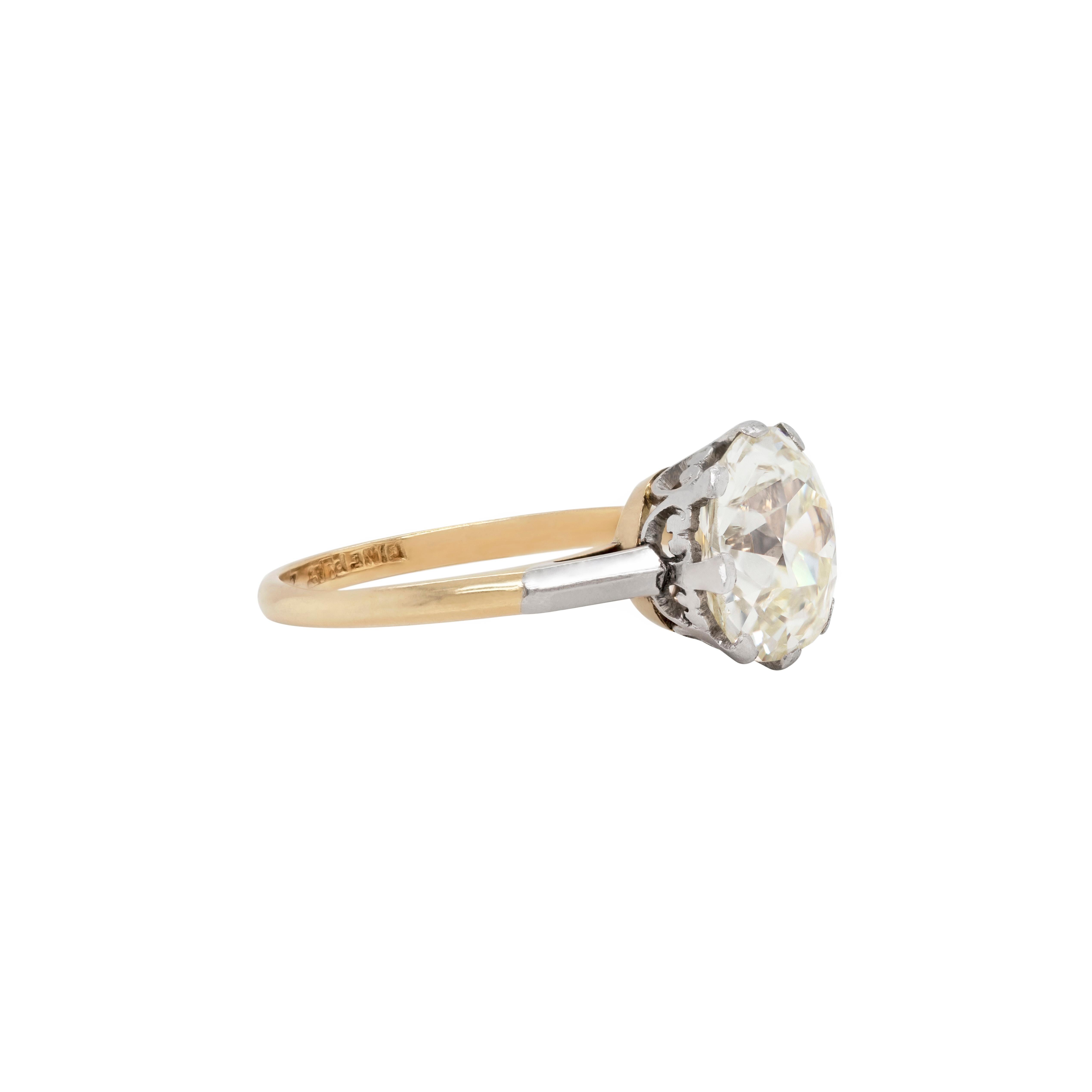 Beautiful antique engagement ring set with a cushion shaped old cut diamond weighing 3.42 carats mounted in an open back, intricate crown eight claw platinum collet and 18 carat gold shank. The ring is an original Edwardian piece marked 18CT and