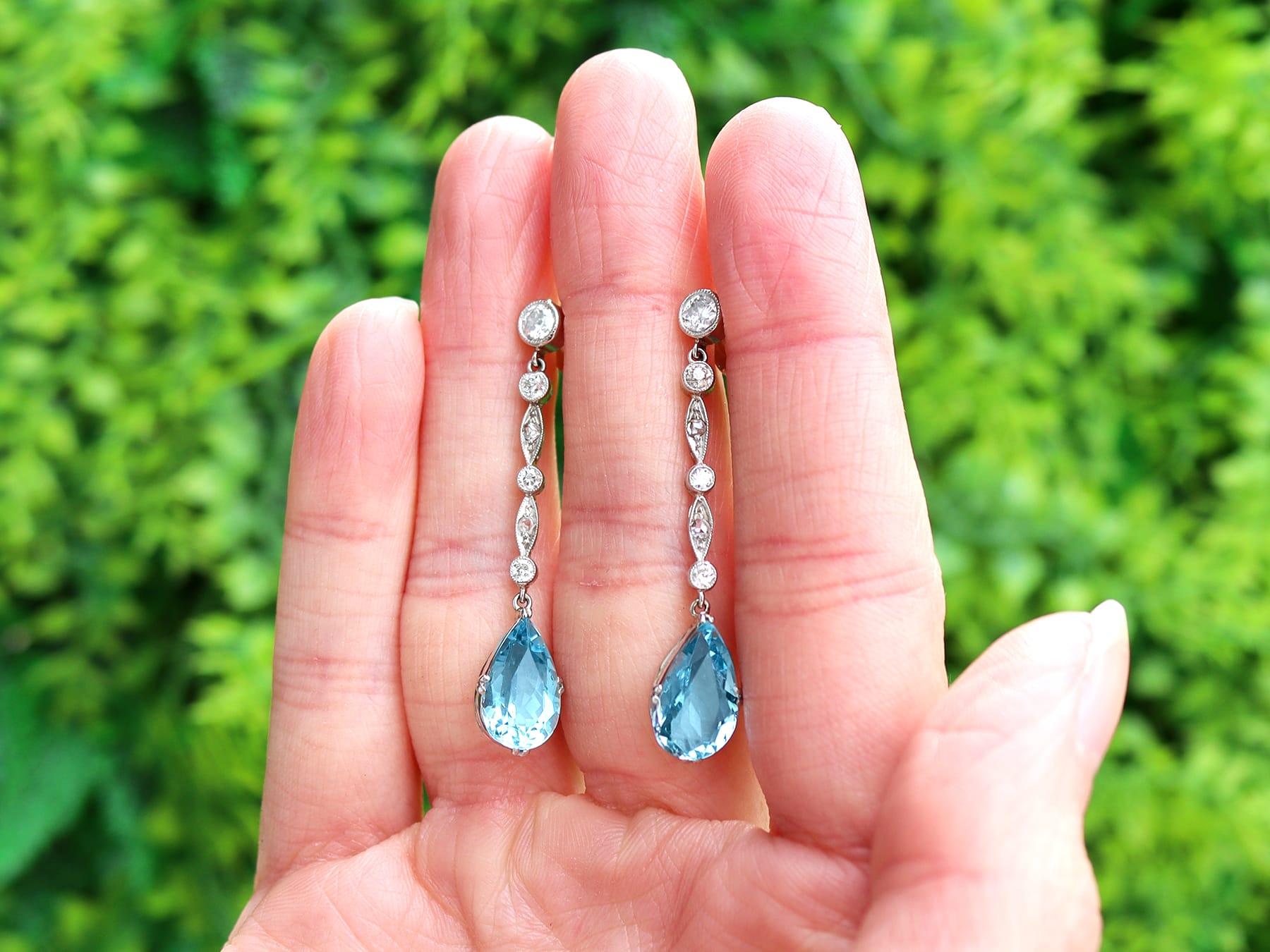 A stunning, fine and impressive pair of antique 3.45 carat aquamarine and 0.60 carat diamond, platinum drop earrings; part of our antique aquamarine jewelry collection.

These stunning, fine and impressive antique aquamarine earrings are crafted in