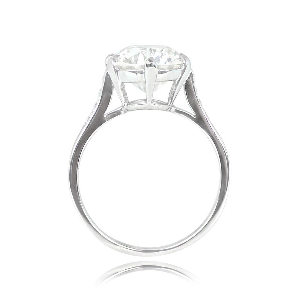 This exquisite French Art Deco engagement ring showcases a central 3.48-carat old European cut diamond, set securely in prongs. The featured diamond boasts a J color grade and VS1 clarity. Enhancing its elegance, smaller old European cut diamonds