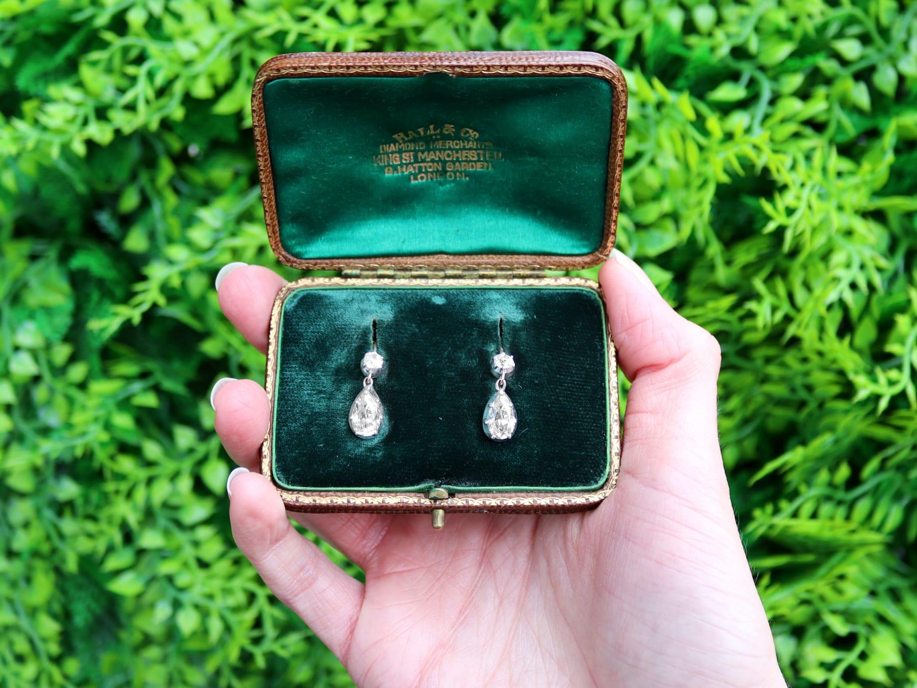 A stunning, fine and impressive pair of antique 3.58 carat diamond and 9 karat yellow gold, silver set drop earrings; part of our diverse antique estate jewelry collections.

These stunning antique diamond earrings have been crafted in 9k yellow