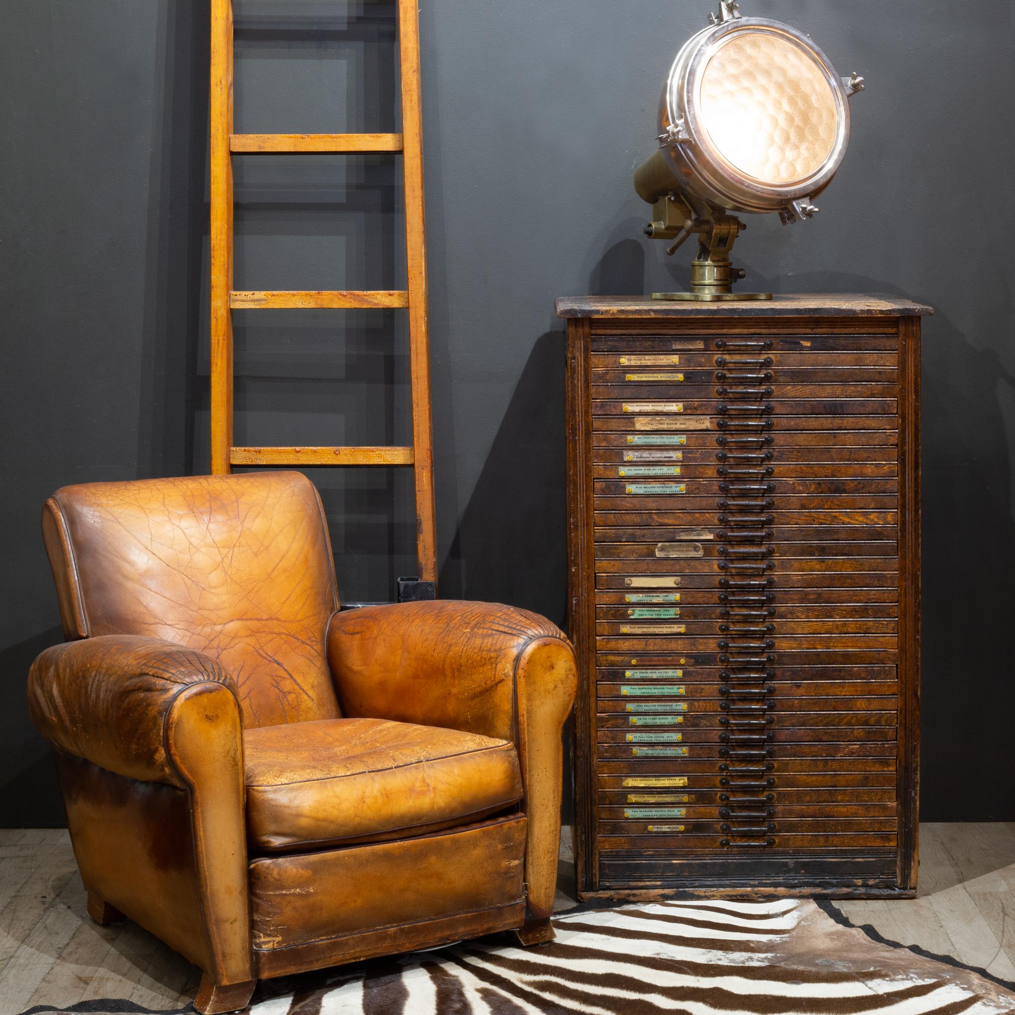 ABOUT

An early 20th century printer's wooden typeset cabinet with 36 wooden segmented drawers used to house steel typeset letters. Original cast iron pulls and font labels. The piece is structurally sound and has retained the naturally distressed