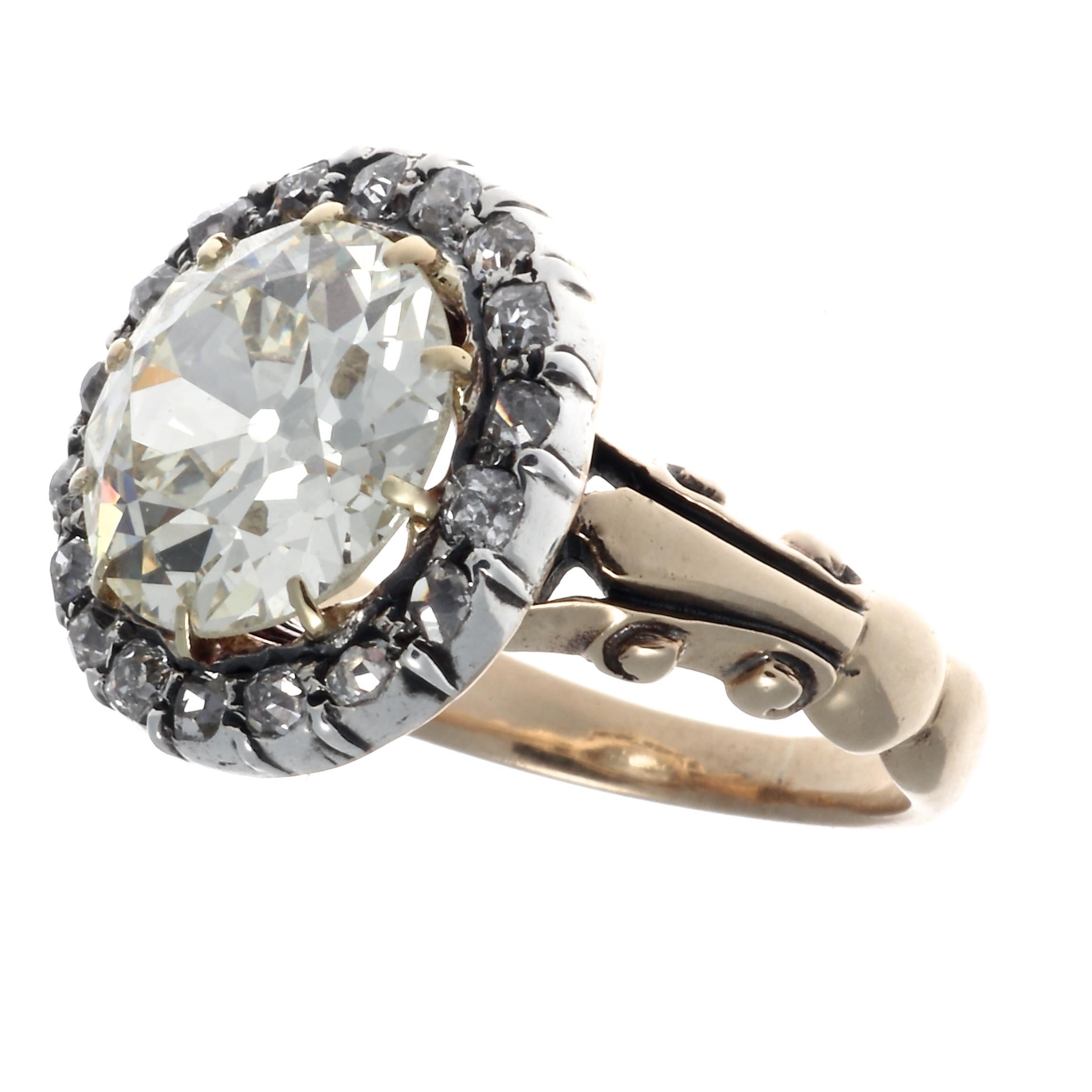 Unique and special late Georgian diamond and gold engagement ring. Featuring a 3.62 old European cut diamond graded O-P color, VS clarity. Surrounded by a halo of 18 old mine cut diamonds that weigh approximately 0.30 carats, graded I-J color, VS-SI
