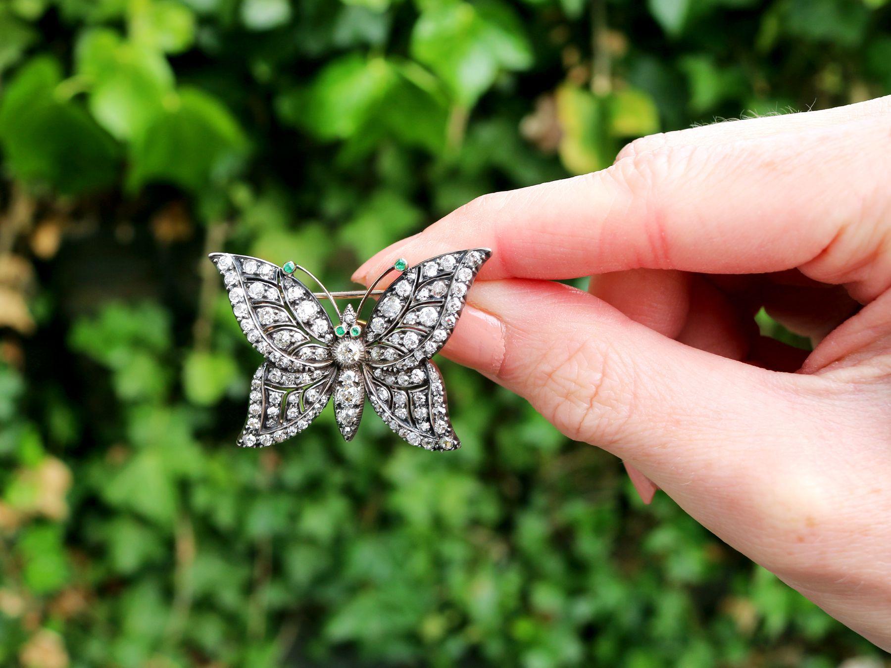 A stunning, fine and impressive antique 3.88 carat diamond and 0.04 carat emerald, 9 karat yellow gold and silver set butterfly brooch; part of our antique jewelry collections.

This stunning, fine and impressive antique brooch has been crafted in