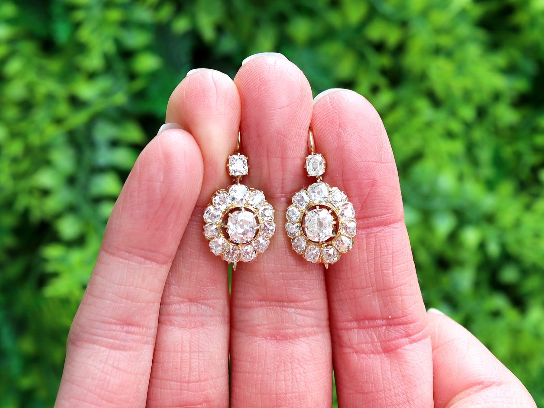 A stunning, fine and impressive pair of antique Victorian 3.91 carat diamond and 15 karat yellow gold cluster drop earrings; part of our diverse diamond jewelry collection.

These stunning, fine and impressive antique diamond cluster earrings have