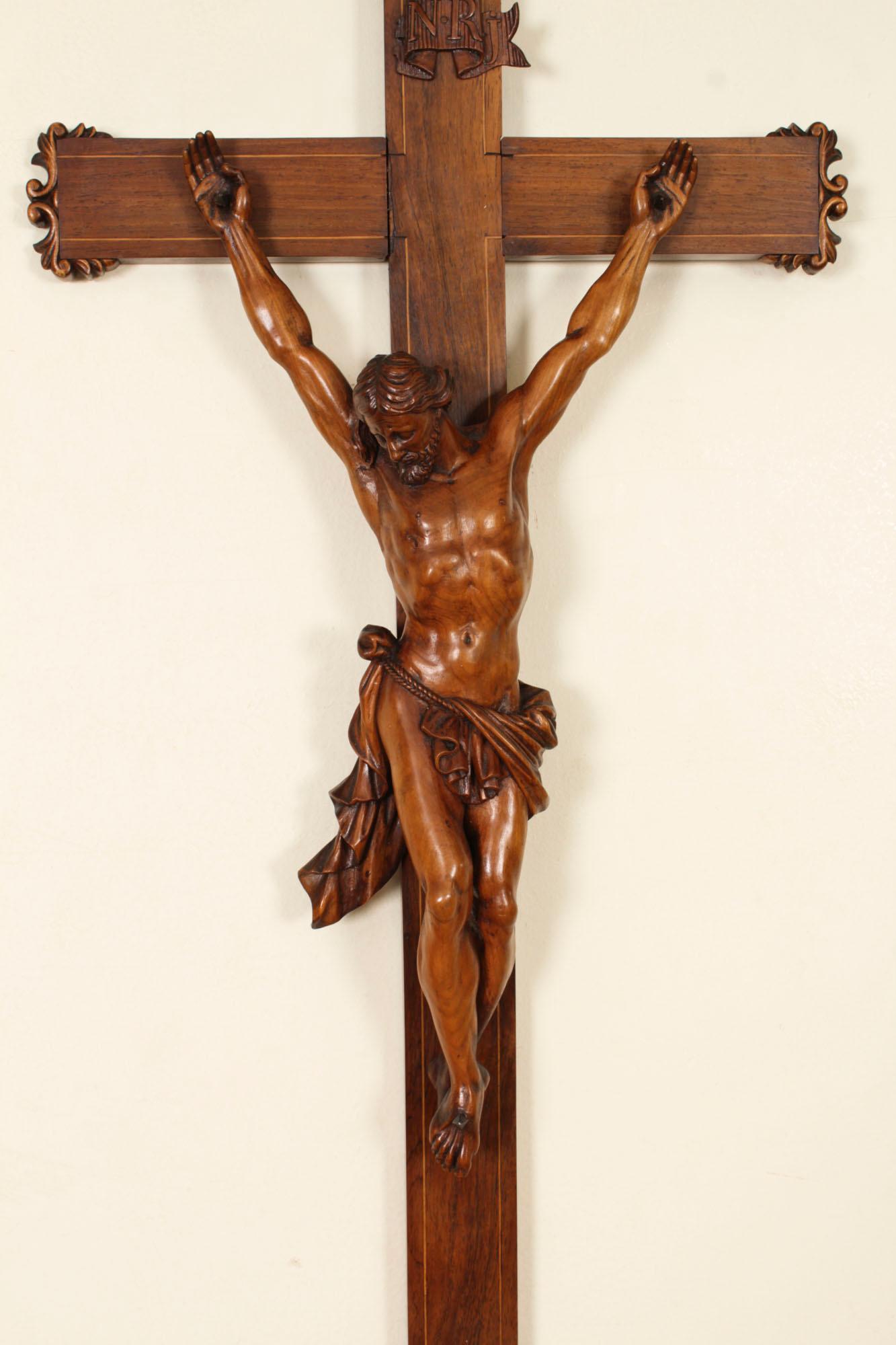 This is a large fine antique French patinated walnut Corpus Christi altar cross, circa 1860 in date.

The details  are very impressive, the Corpus Christi is very finely carved and life-like, wearing a flowing linen cloth, his eyes closed and head