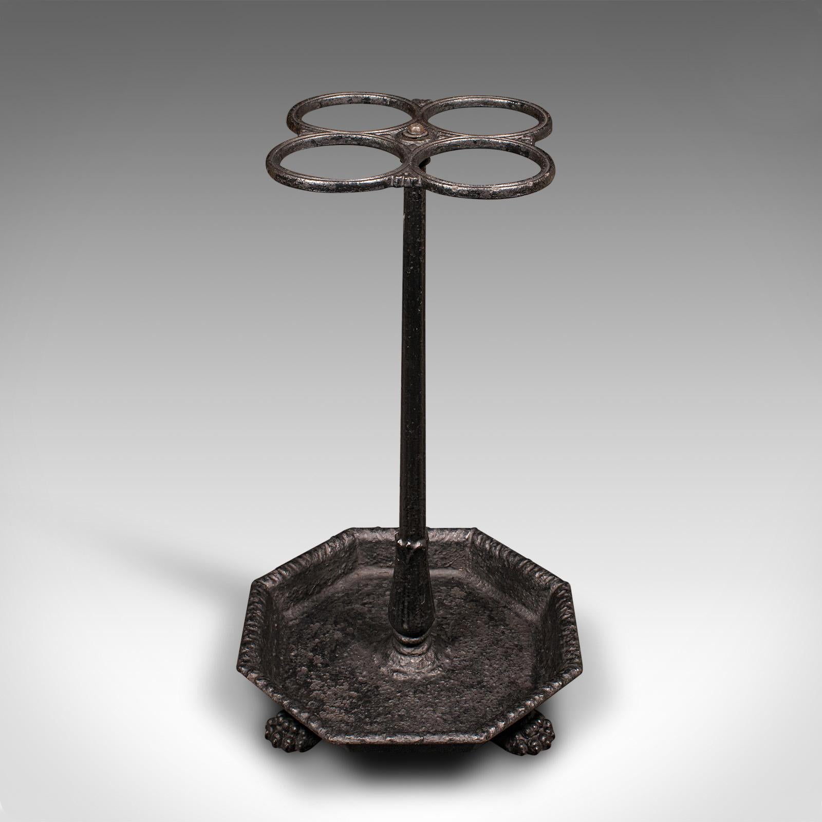 This is an antique four division umbrella rack. An English, cast iron hallway stick stand, dating to the Georgian period, circa 1800.

Appealing spherical form a distinctive treat for the reception hall
Displays a desirable aged patina and in good