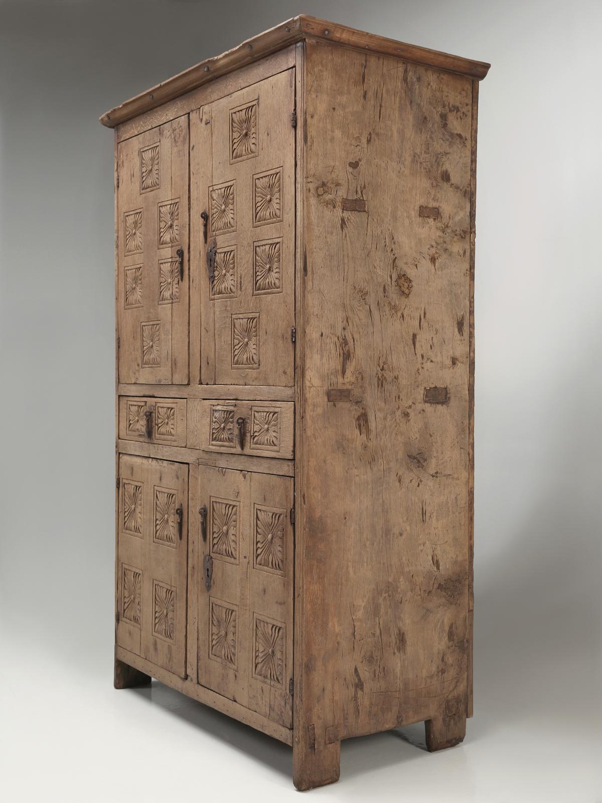 Generally, as soon as we unpack our container shipments from France, we pretty much know what we have, its age and country of origin. This antique cupboard or antique armoire has us a bit mystified as to its birthplace. Deciding how old was not