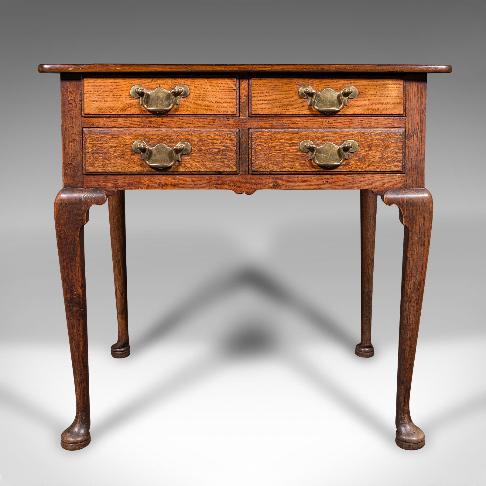 
This is an antique 4-drawer lowboy. An English, oak and walnut correspondence desk, dating to the Georgian period and later, circa 1750.

Charming small table, with great colour and attractive craftsmanship
Displays a desirable aged patina and in