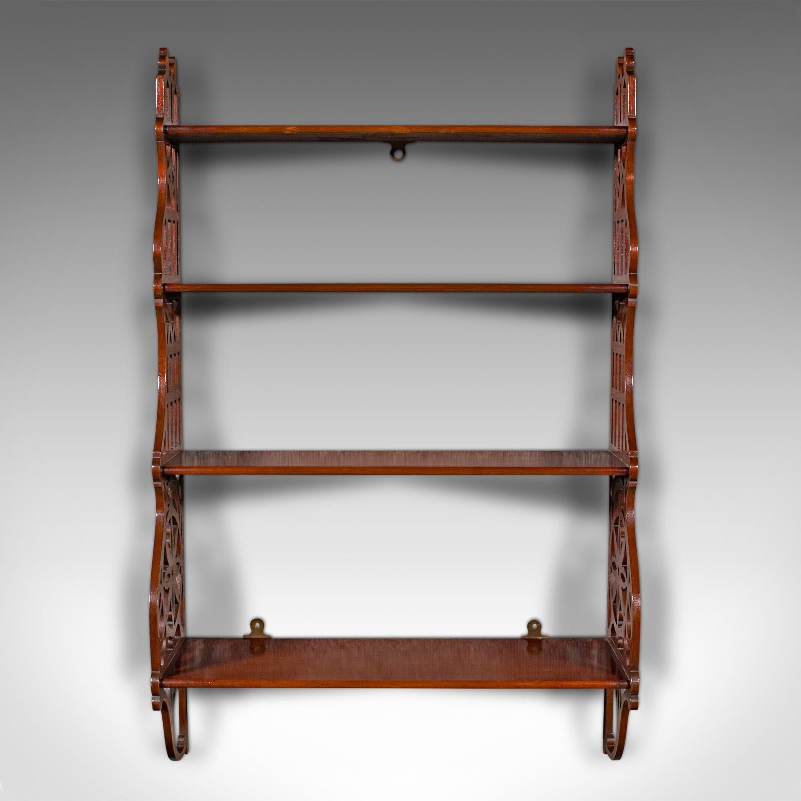
This is an antique 4-tier mounted whatnot. An English, mahogany set of wall shelves, dating to the Edwardian period, circa 1910.

Elegantly finished with an appealing graduated form
Displaying a desirable aged patina and in good order
Select stocks