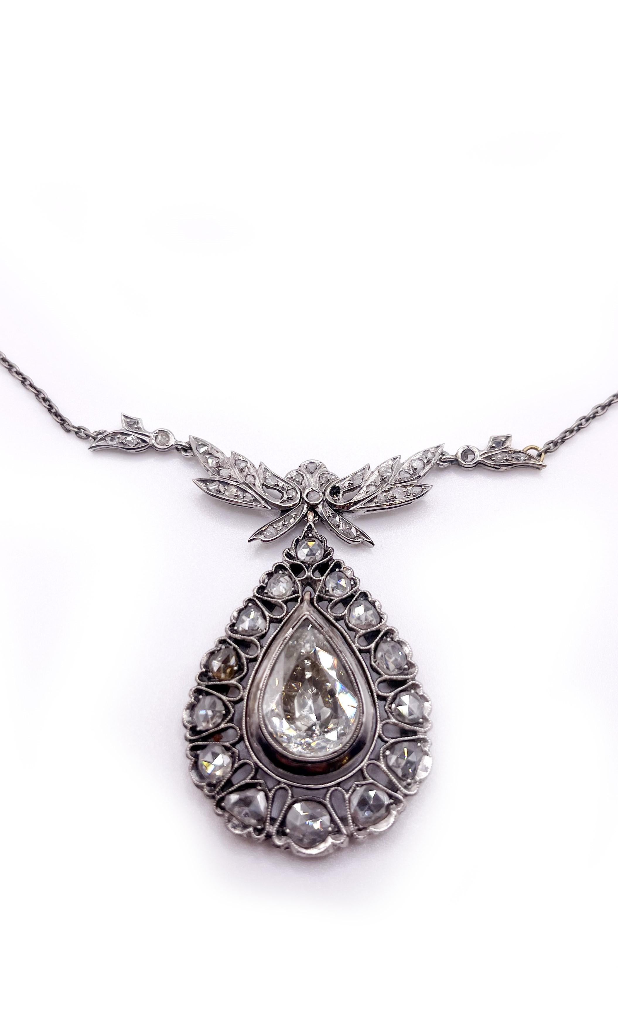 Stunning vintage rose cut diamond drop pendent necklace.
approximately 4.00 carats central pear rose cut diamond . approximately G color and VS clarity .
the central rose diamond surrounded by 15 smaller rose cut diamond in approximately 2.00 carats.