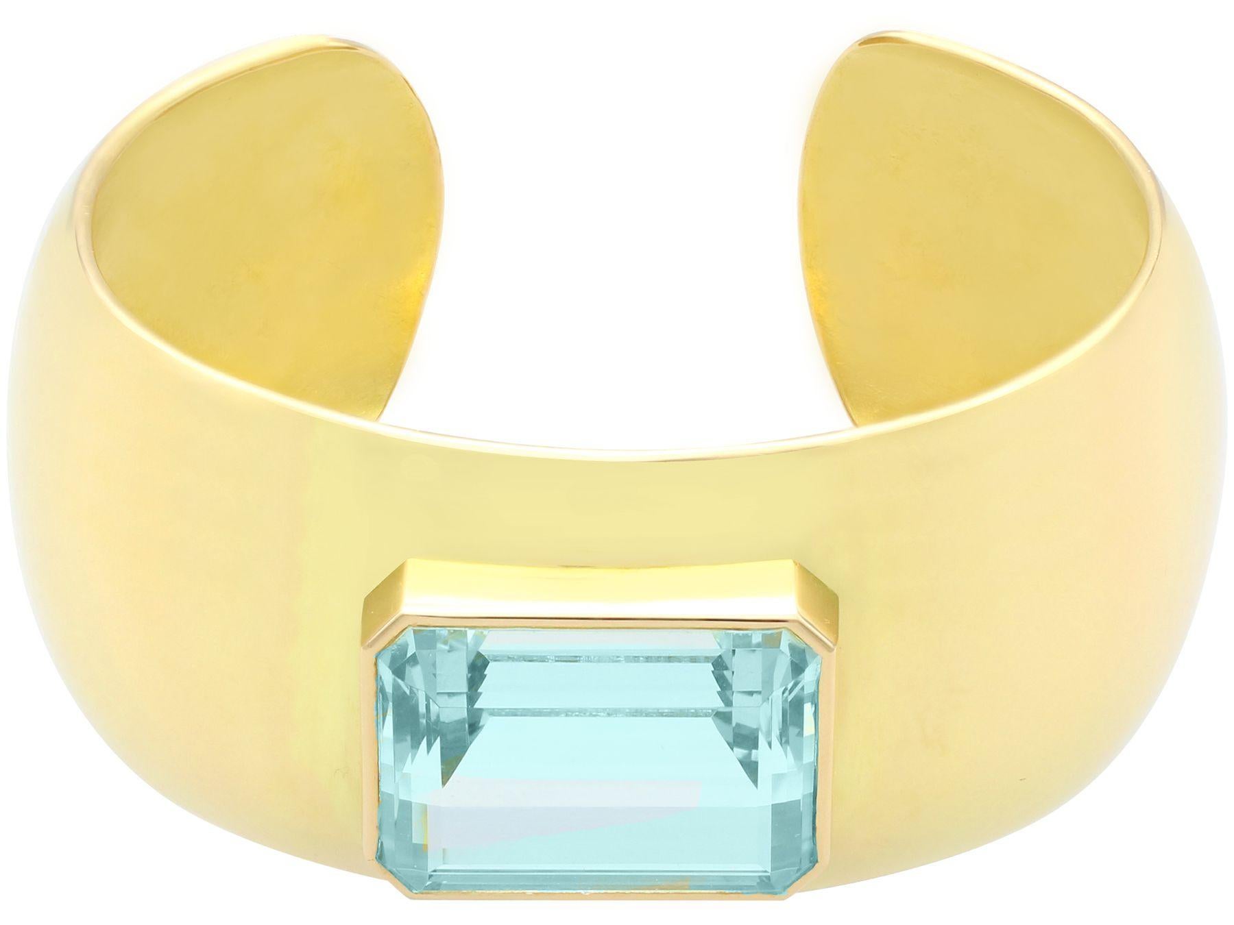 A stunning, fine and impressive vintage 40.35 carat aquamarine and 18 karat yellow gold cuff bangle; part of our bangle and bracelet collection.

This stunning, fine and impressive vintage aquamarine bangle has been crafted in 18k yellow gold.

The