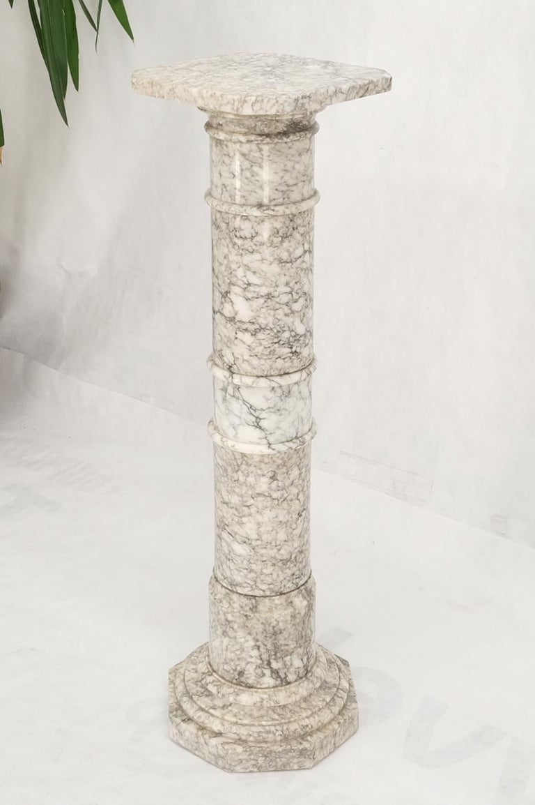 Stunning gray and white marble veins pattern round turned marble pedestal stand.