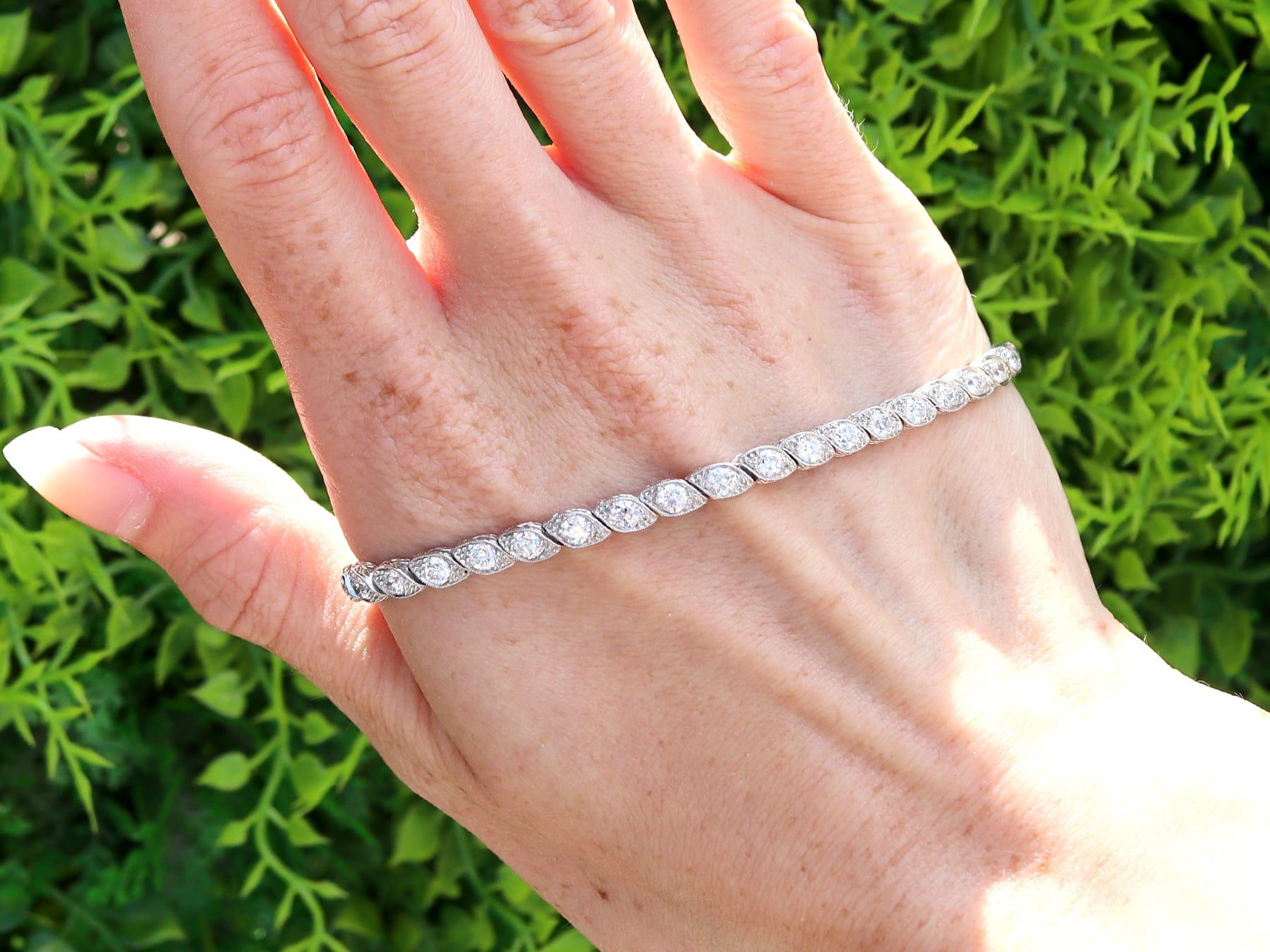 A stunning, fine and impressive antique 4.20 carat diamond and platinum bracelet; part of our diverse collection of antique diamond bracelets.

This stunning, fine and impressive antique Edwardian diamond bracelet has been crafted in platinum.

This