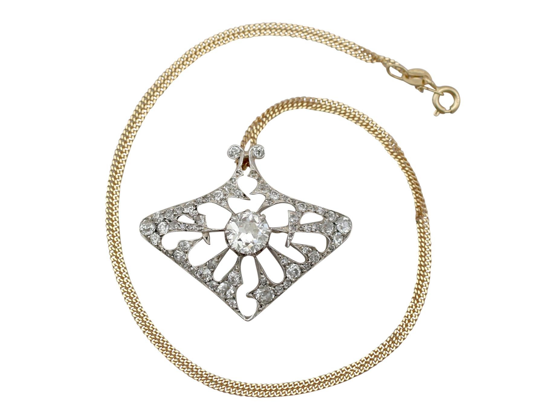 A stunning antique Art Nouveau 4.21 carat diamond and 18 karat yellow gold, silver set pendant / brooch; part of our diverse antique jewellery and estate jewelry collections.

This stunning, fine and impressive Art Nouveau diamond pendant has been